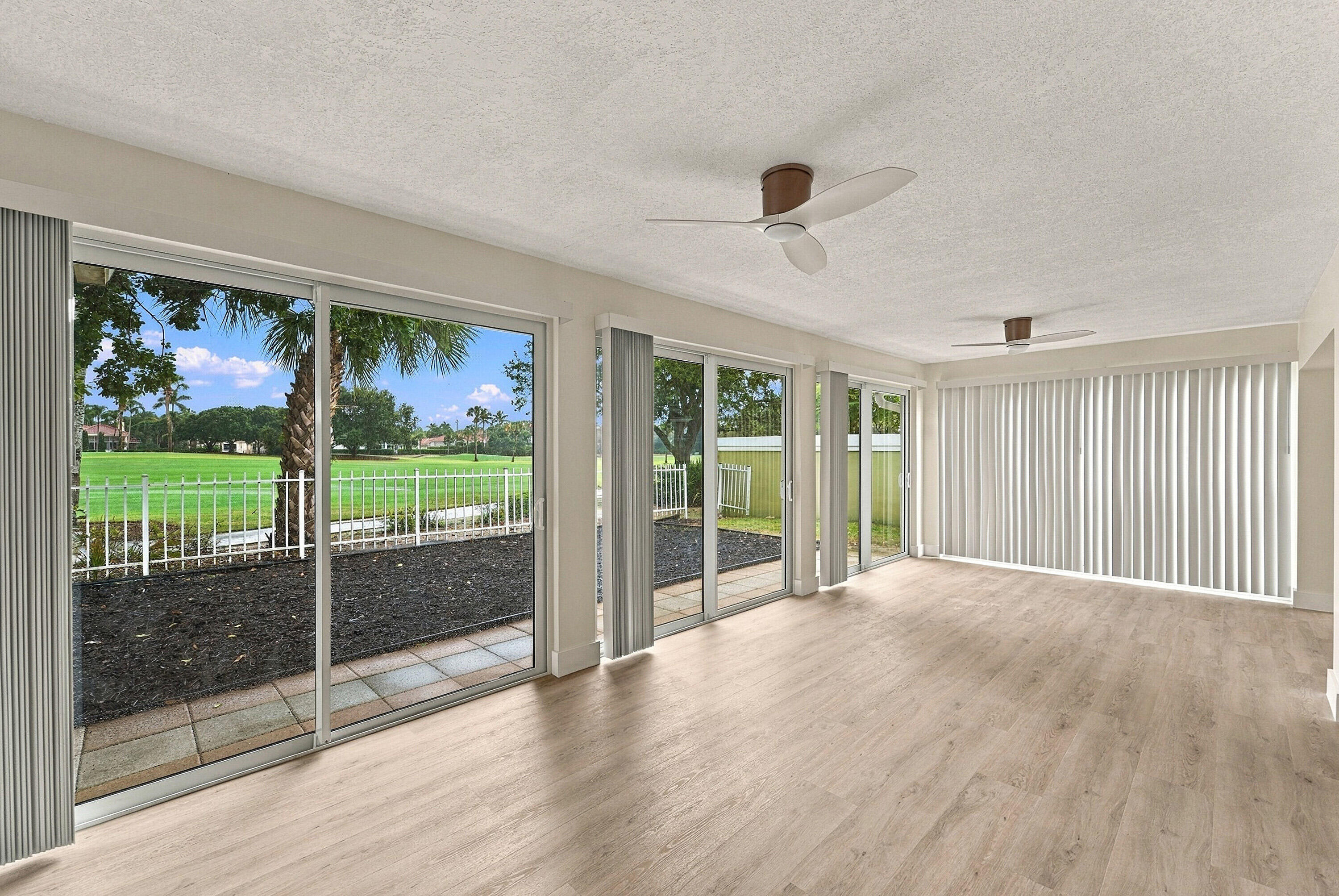 The patio was enclosed to add additional living space along with brand new impact windows.