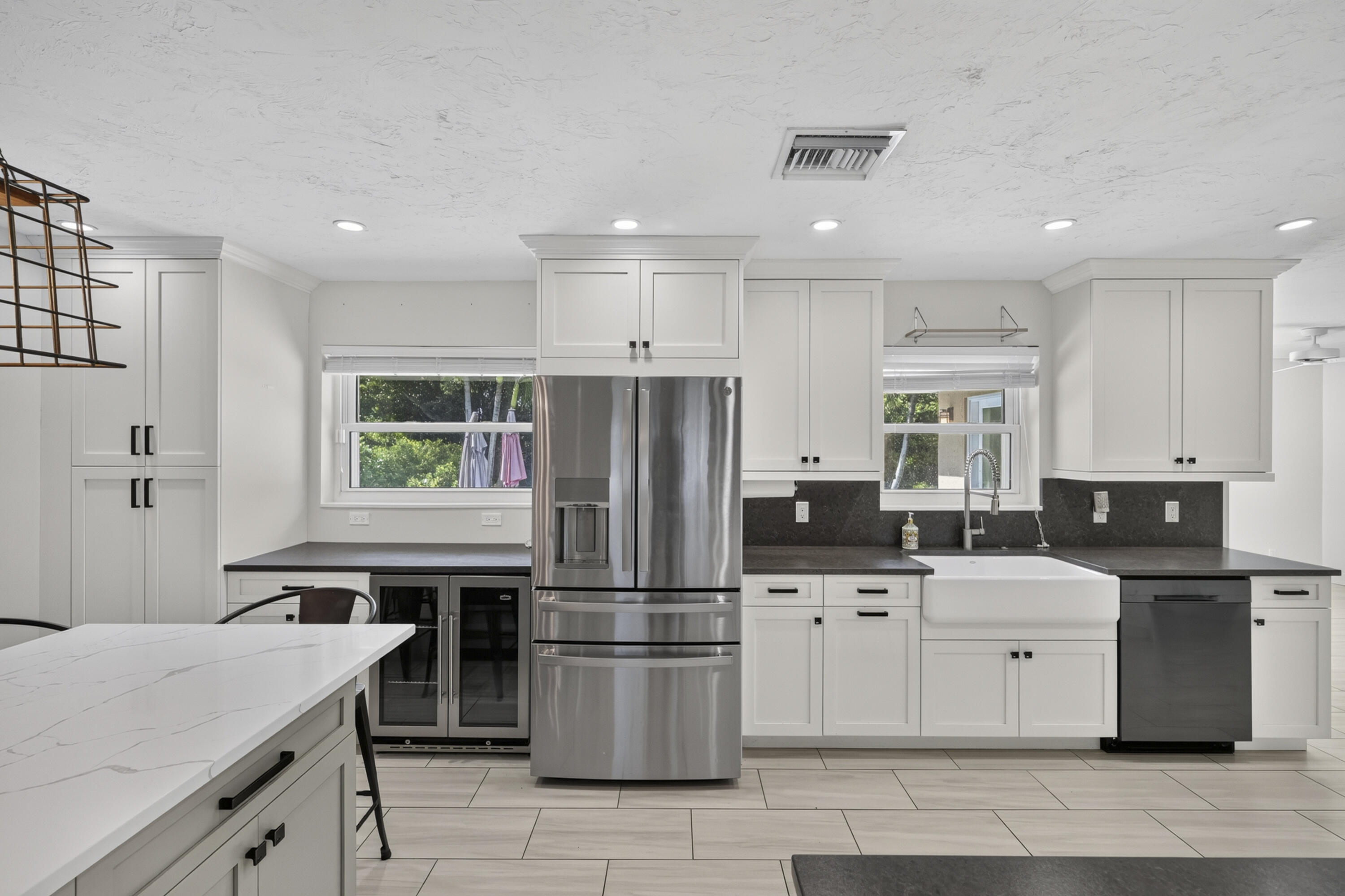 Kitchen With Wine Cooler and Fridge