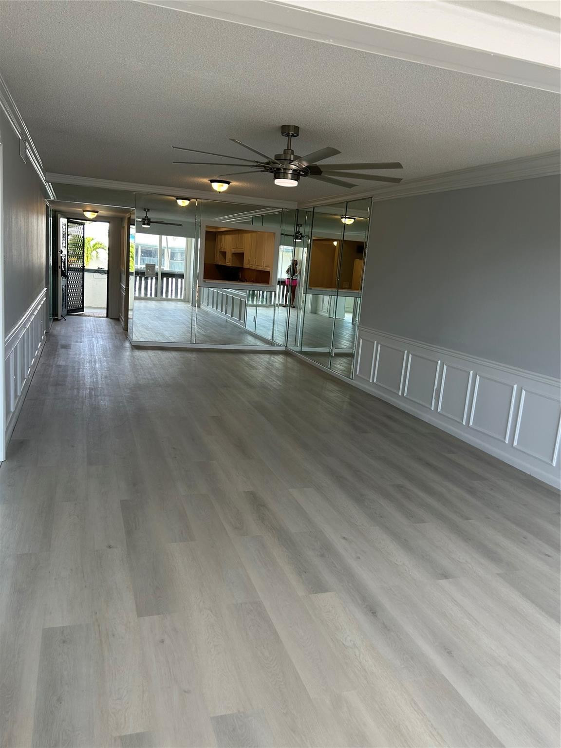 Living / Family space looking towards foyer and kitchen / bar area.