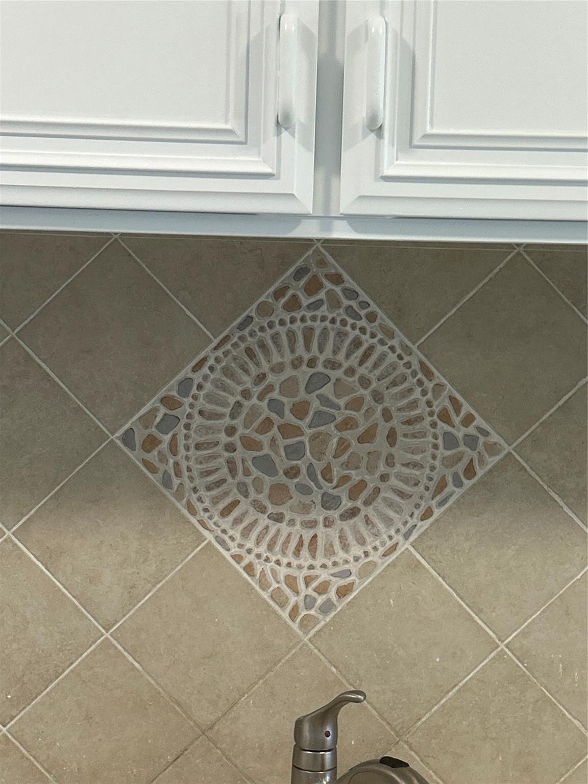 Custom backsplash over kitchen sinks.