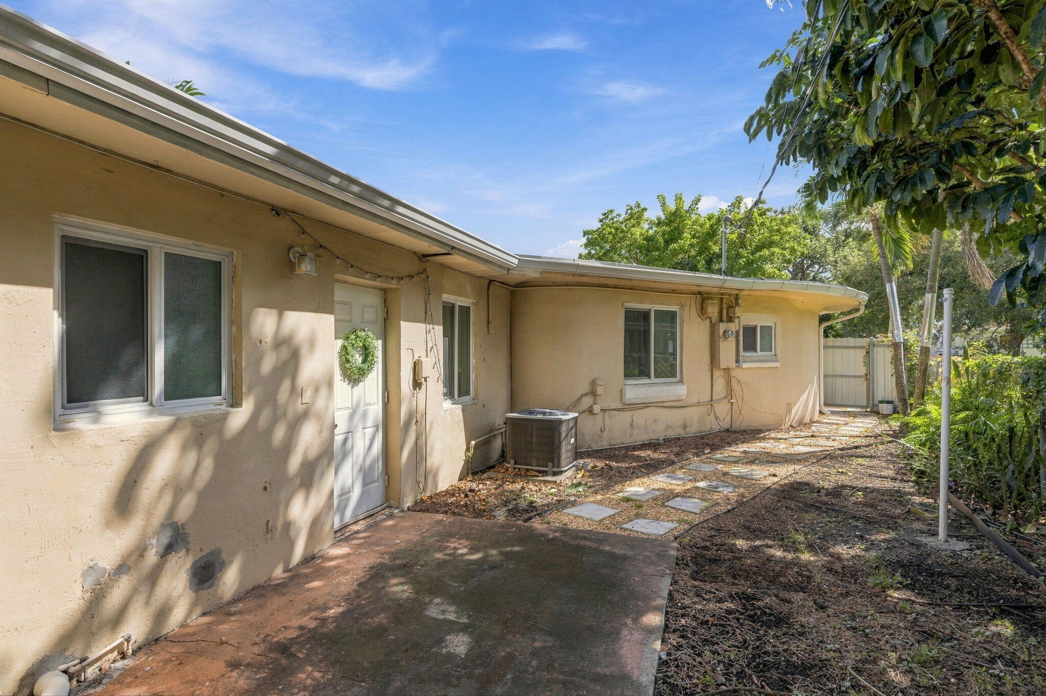 Backyard/Entrance to other side of house