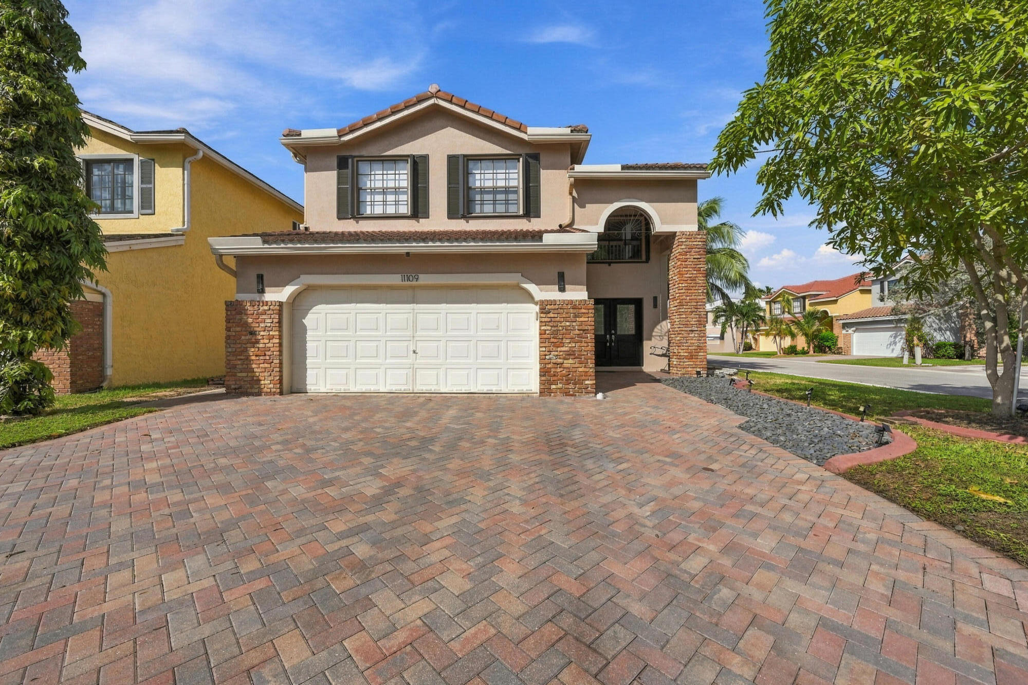 Paver driveway can fit 3 cars in width, and 6 overall.