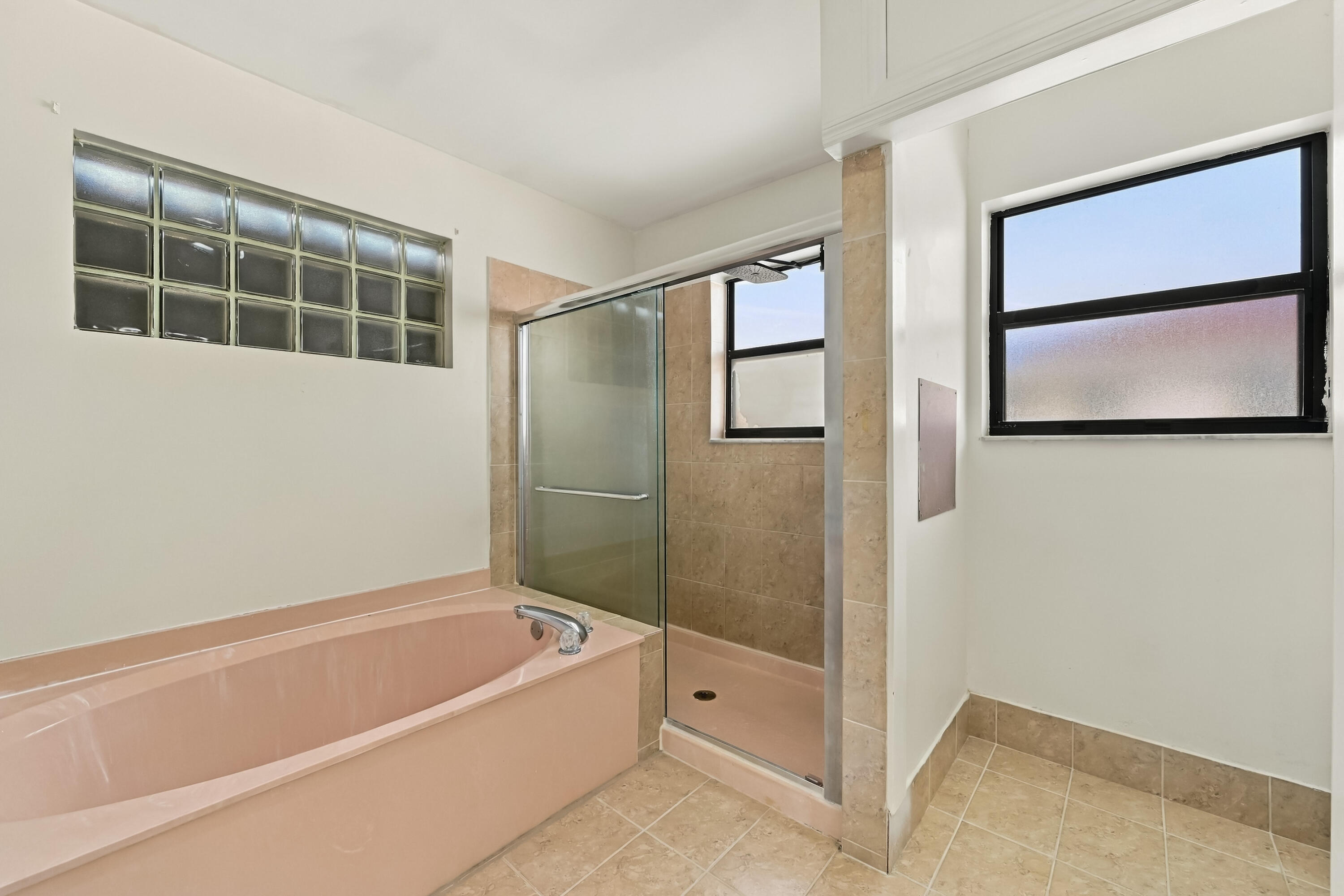 Tub and Shower in primary suite.