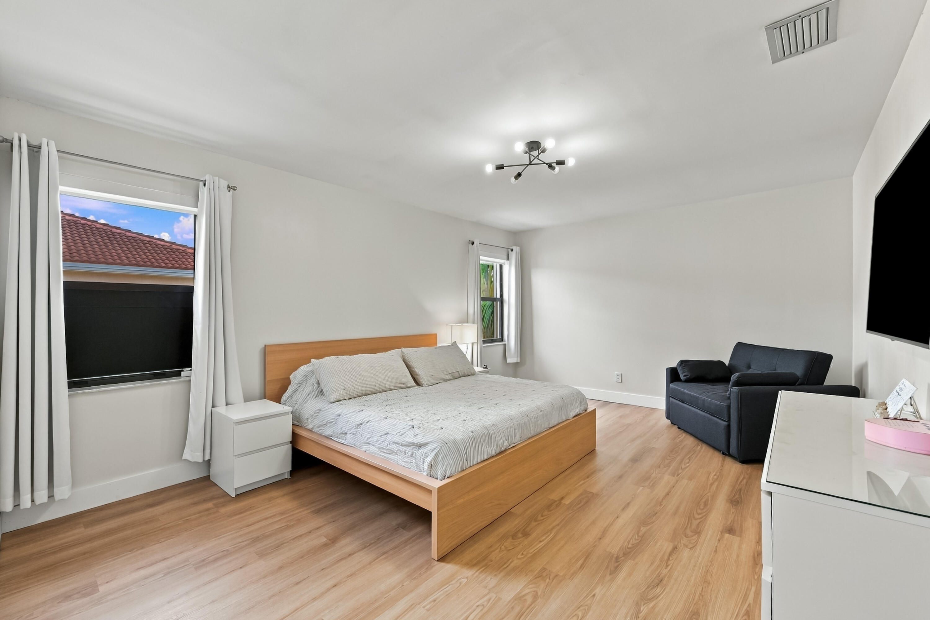 Large Primary bedroom has plenty of room for sitting areas, desk area, lots of light too!