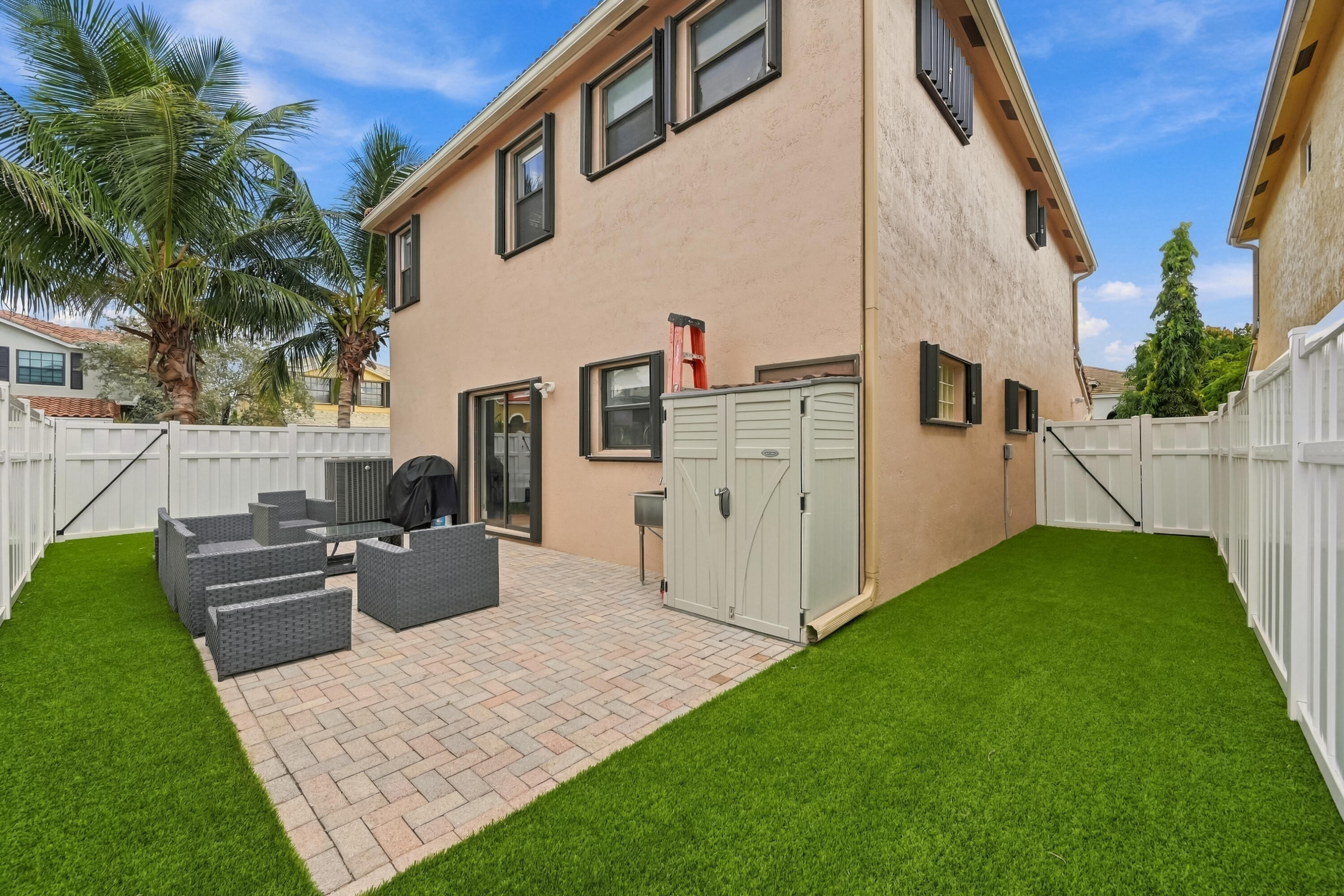 Outdoor sink and storage locker to keep backyard organized.