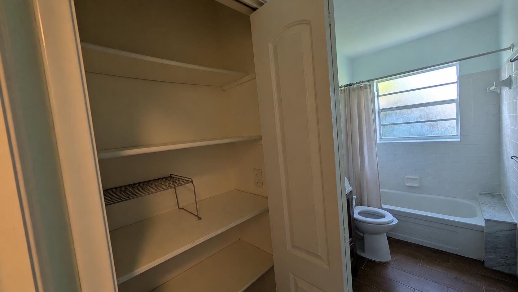Neutral Linen Closet and Bathroom Interi