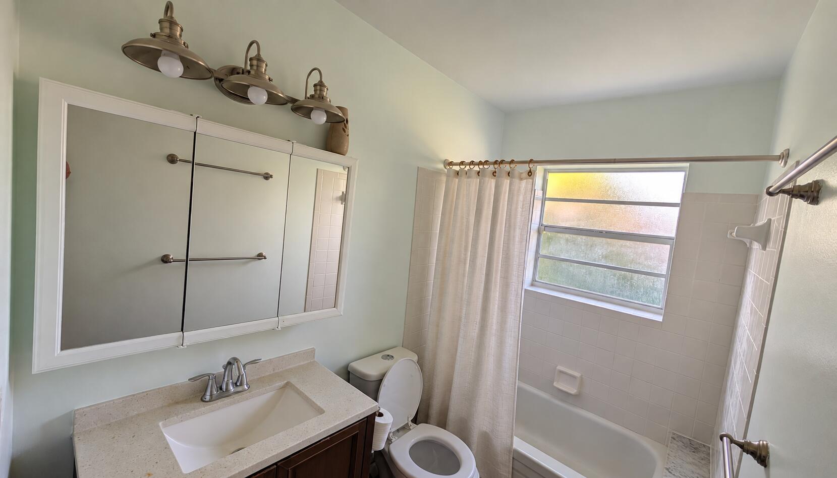 Bright Neutral Bathroom with Frosted Win