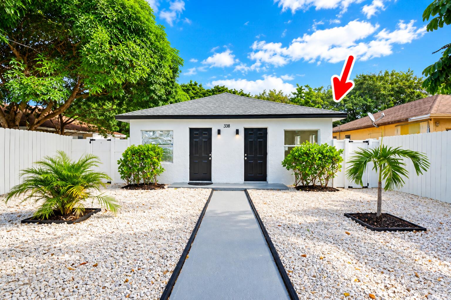 Bright Duplex Exterior with Red Roof Mar