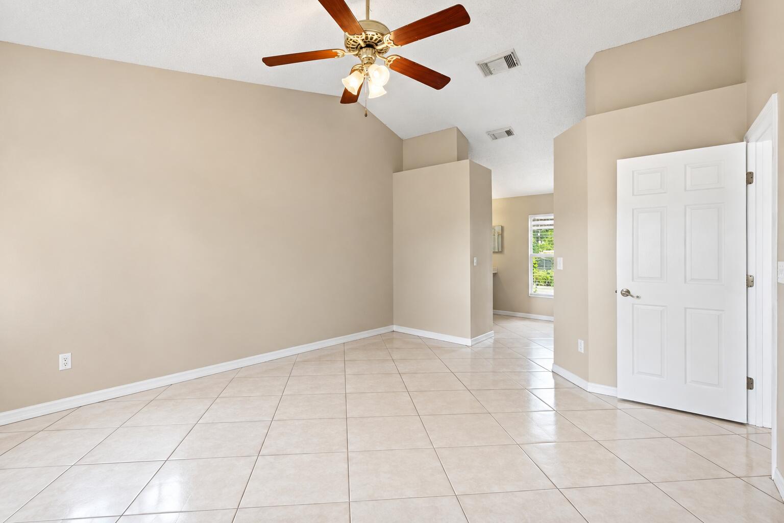 Empty Beige Room with Brass Ceiling Fan