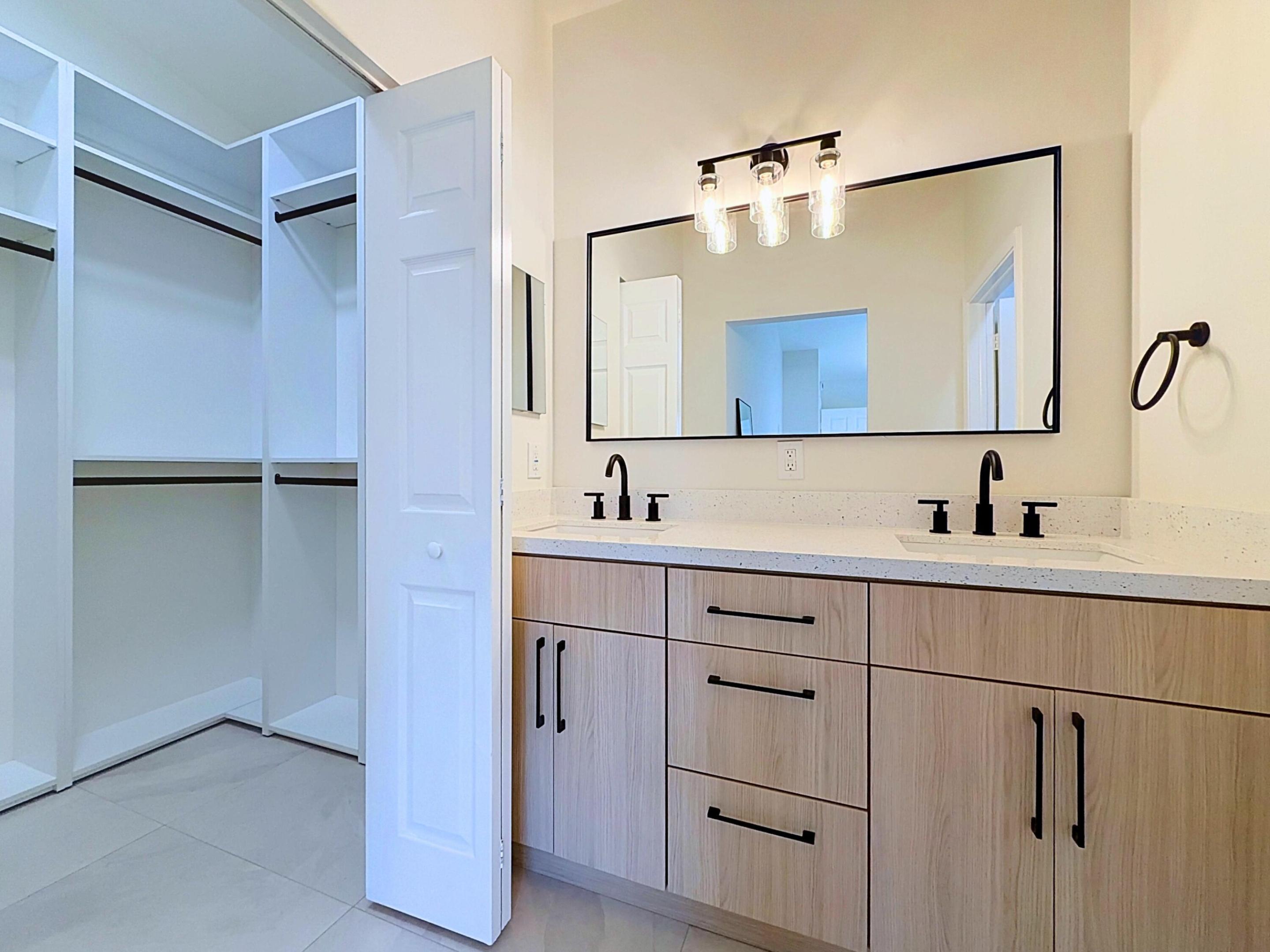 Walk in Closet with fully built out custom closets!