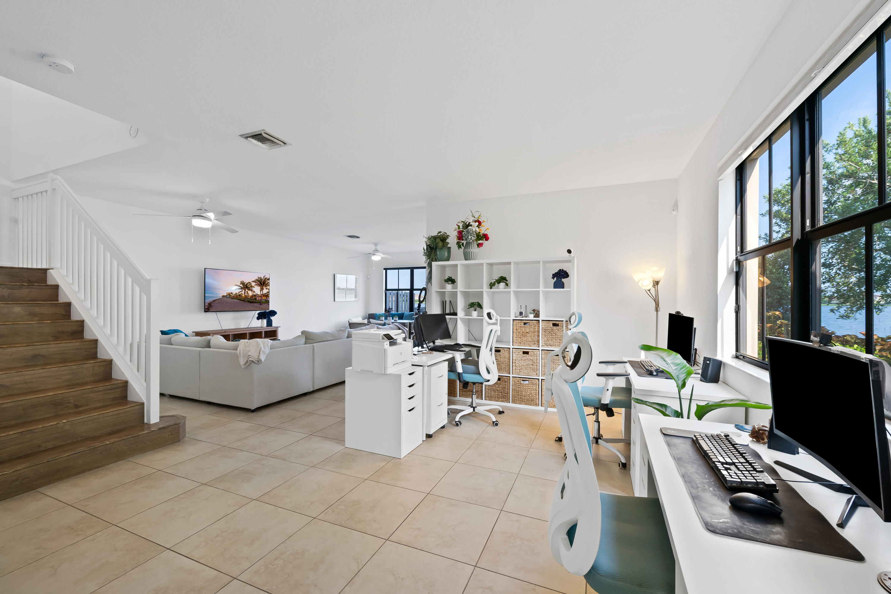 Expansive, versatile space currently used as a home office with endless possibilities for a formal dining room, game room, additional living area and more