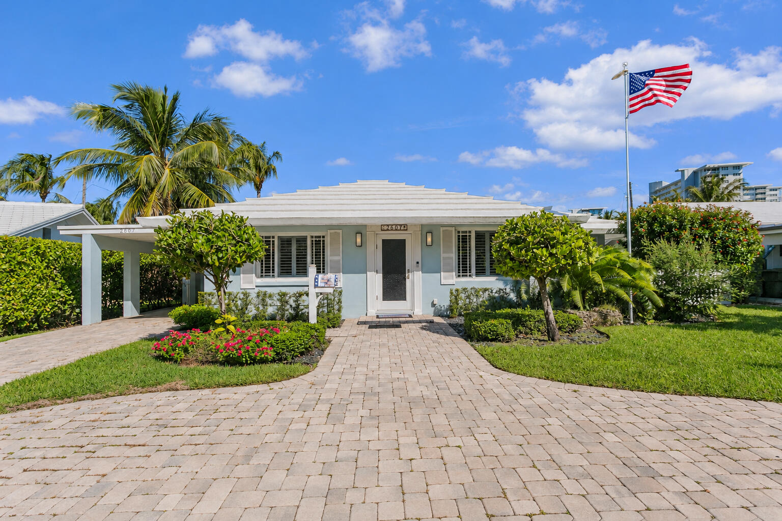Single-story single family residence on Inlet Drive in Exclusive Breakwater Surf Club with attached carport and private yard