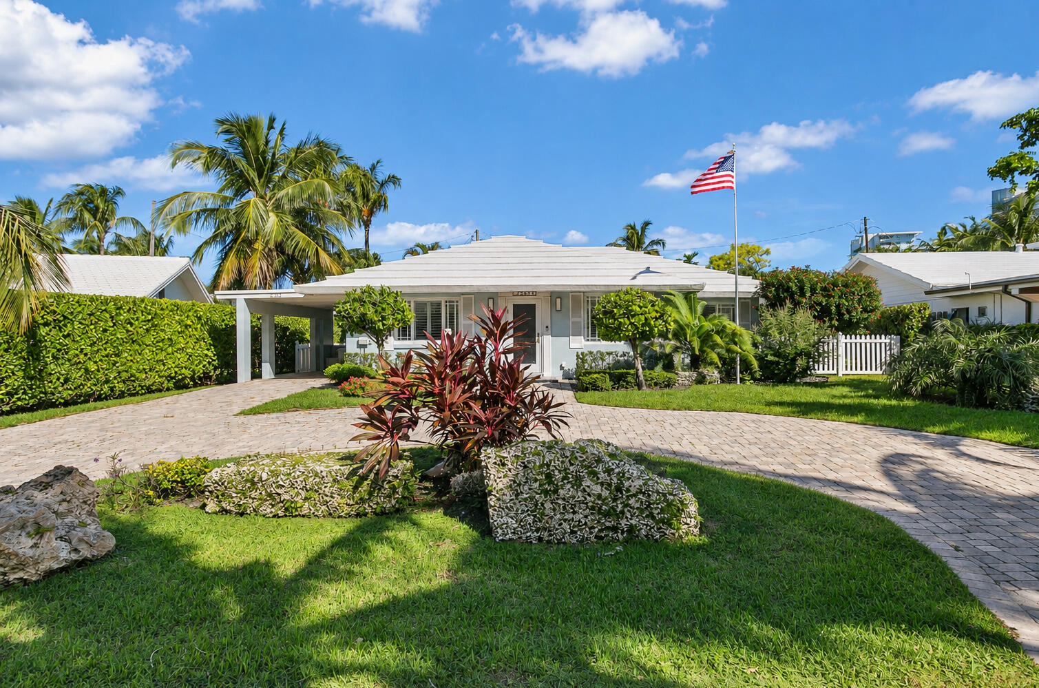 spacious front yard with carport and circular driveway