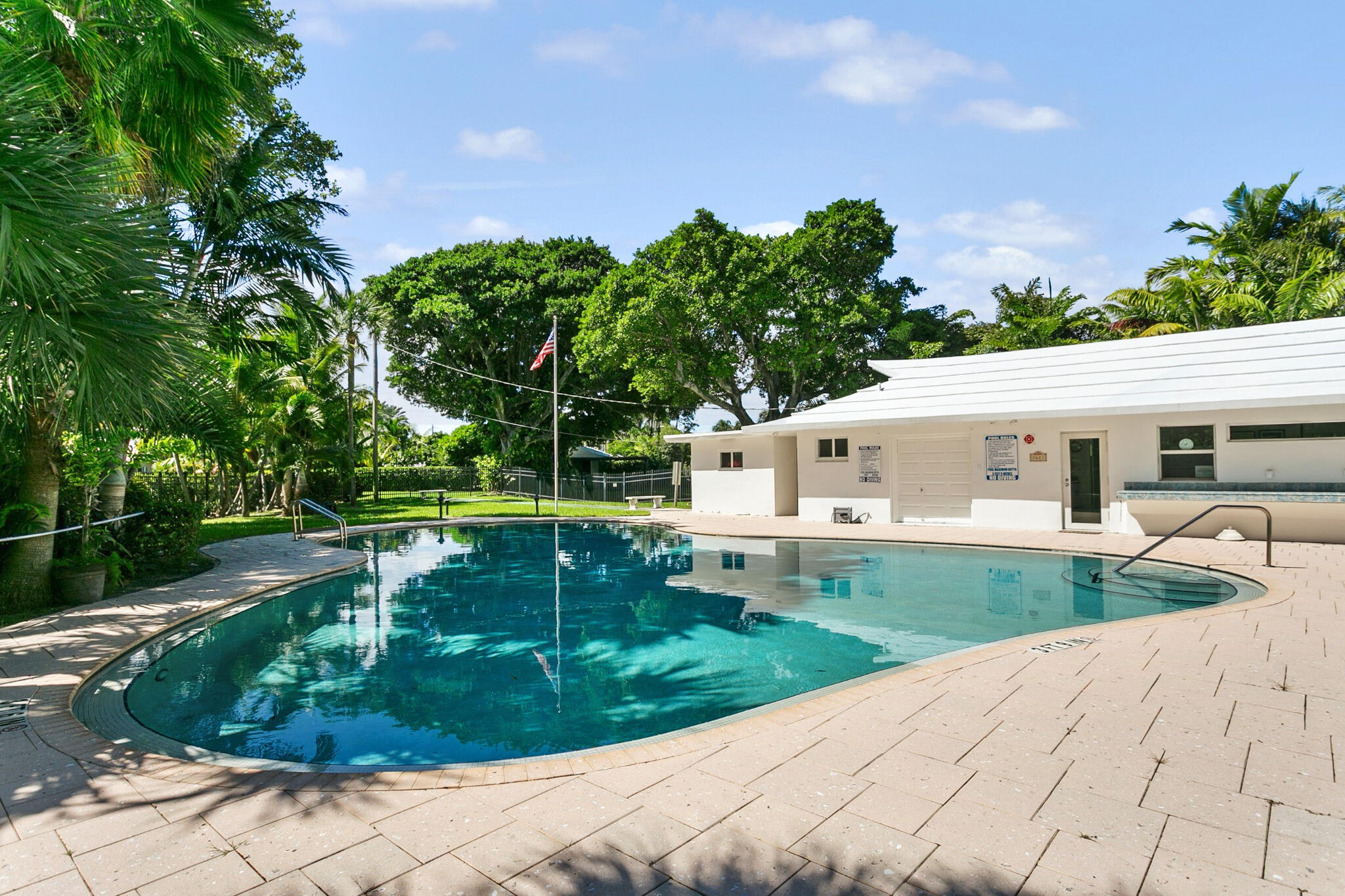 Community Club house with Free-form swimming pool and expansive sunbathing area
