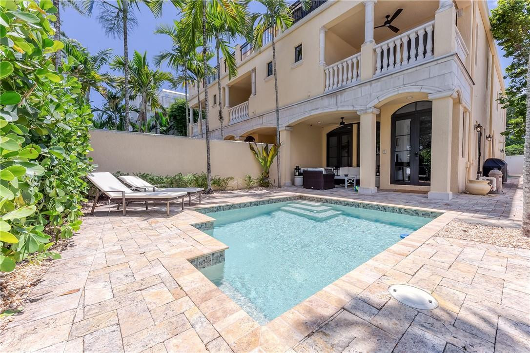 Heated Pool w/ Courtyard entrance via 1st Street & Garage Entrance via rear street.