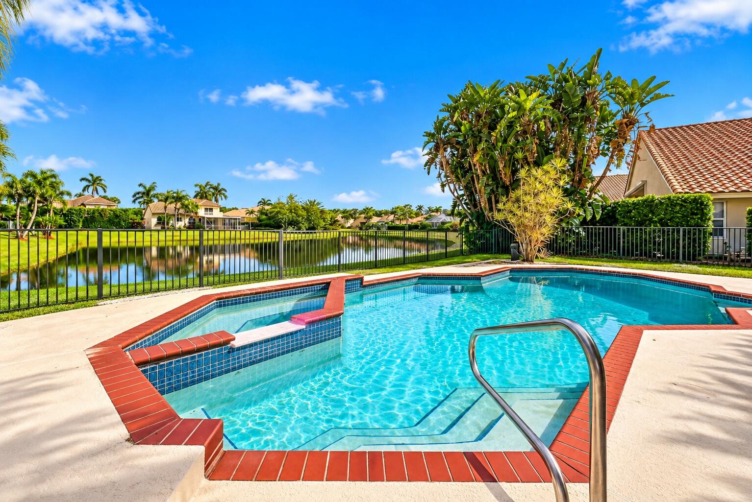 Imagine spending your afternoons lounging poolside and your evenings unwinding in the spa, all while enjoying peaceful, unobstructed views of the lake.