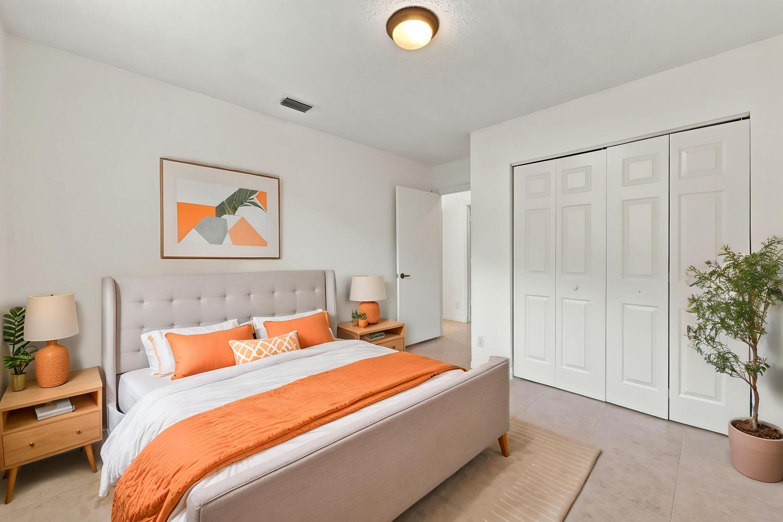 A versatile main-level bedroom offering generous closet space, neutral finishes, and a practical layout ideal for guests or a home office.