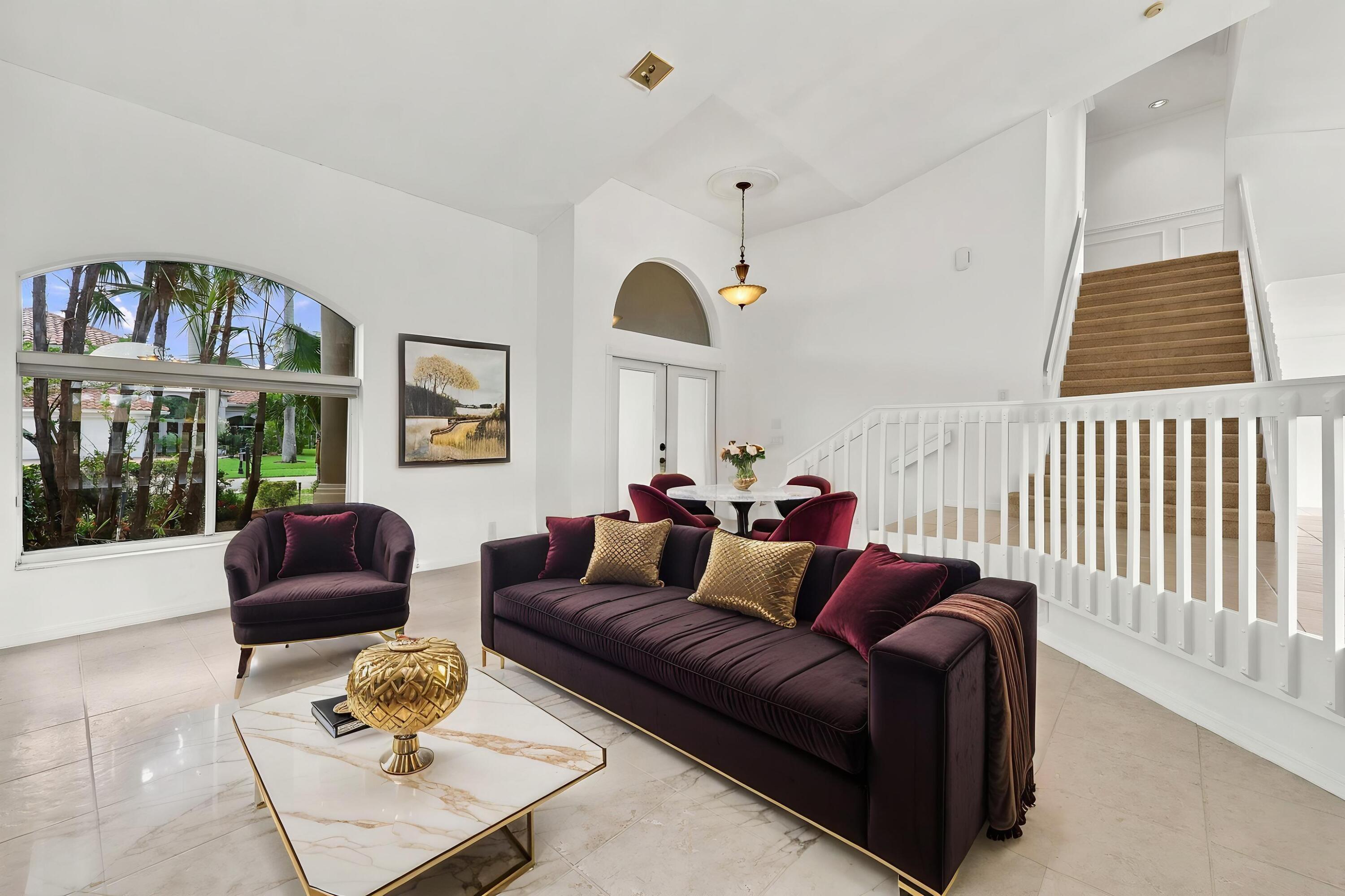 Impressive formal living room with dramatic vaulted ceilings, oversized arched windows, and an open, airy design that creates a wonderful first impression. Impressive formal living room with dramatic vaulted ceilings, oversized arched windows, and an open, airy design that creates a wonderful first impression.