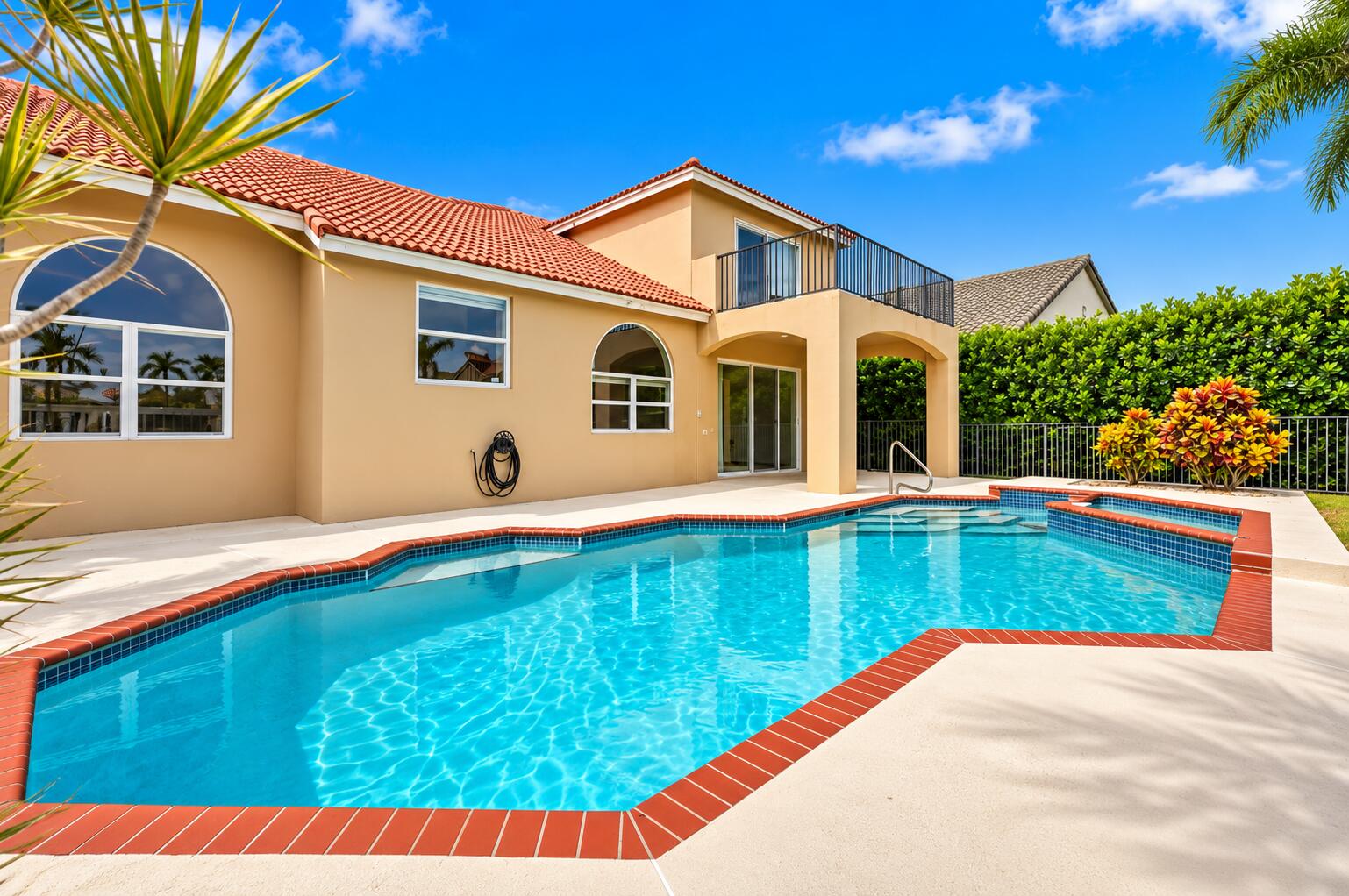 Resort-style living right in your own backyard! This spectacular private pool and spa create the perfect setting for relaxation, entertaining, and soaking up the South Florida sunshine.