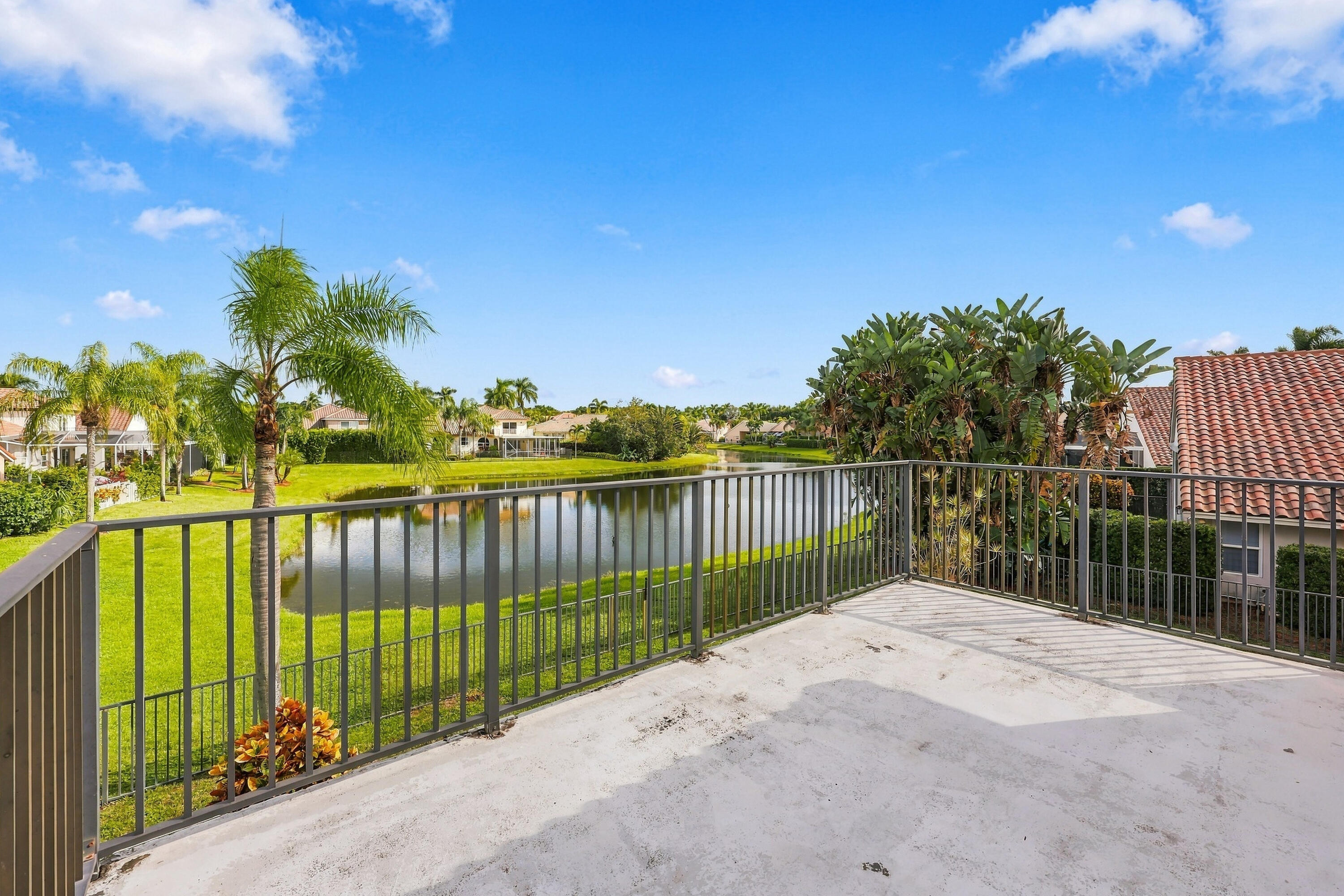 Breathtaking lake views from your private second-story balcony! The perfect place to enjoy your morning coffee while overlooking the peaceful waterfront and lush tropical surroundings.