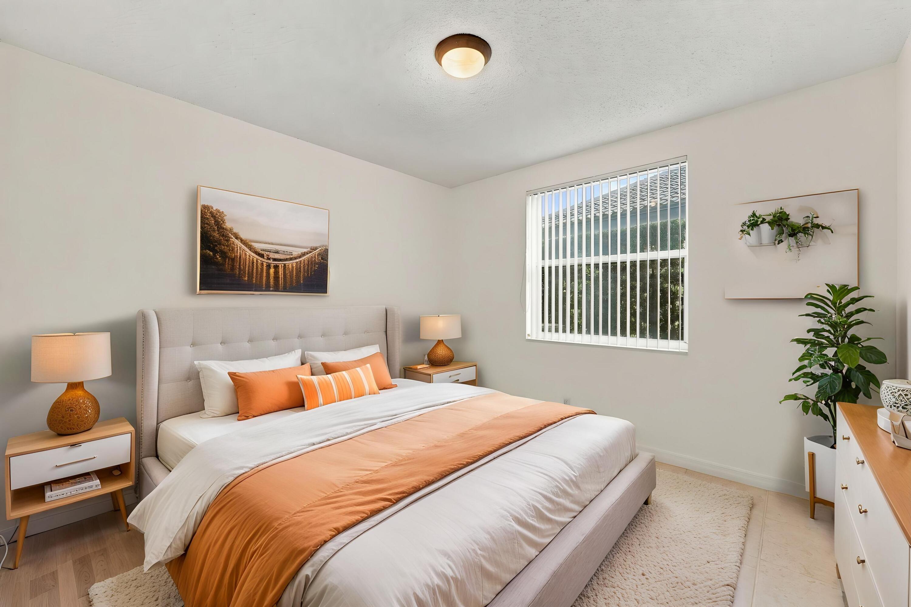 This well-appointed main-level bedroom offers flexibility for guests, a private office, or additional living space, with convenient access to the home's main living areas.