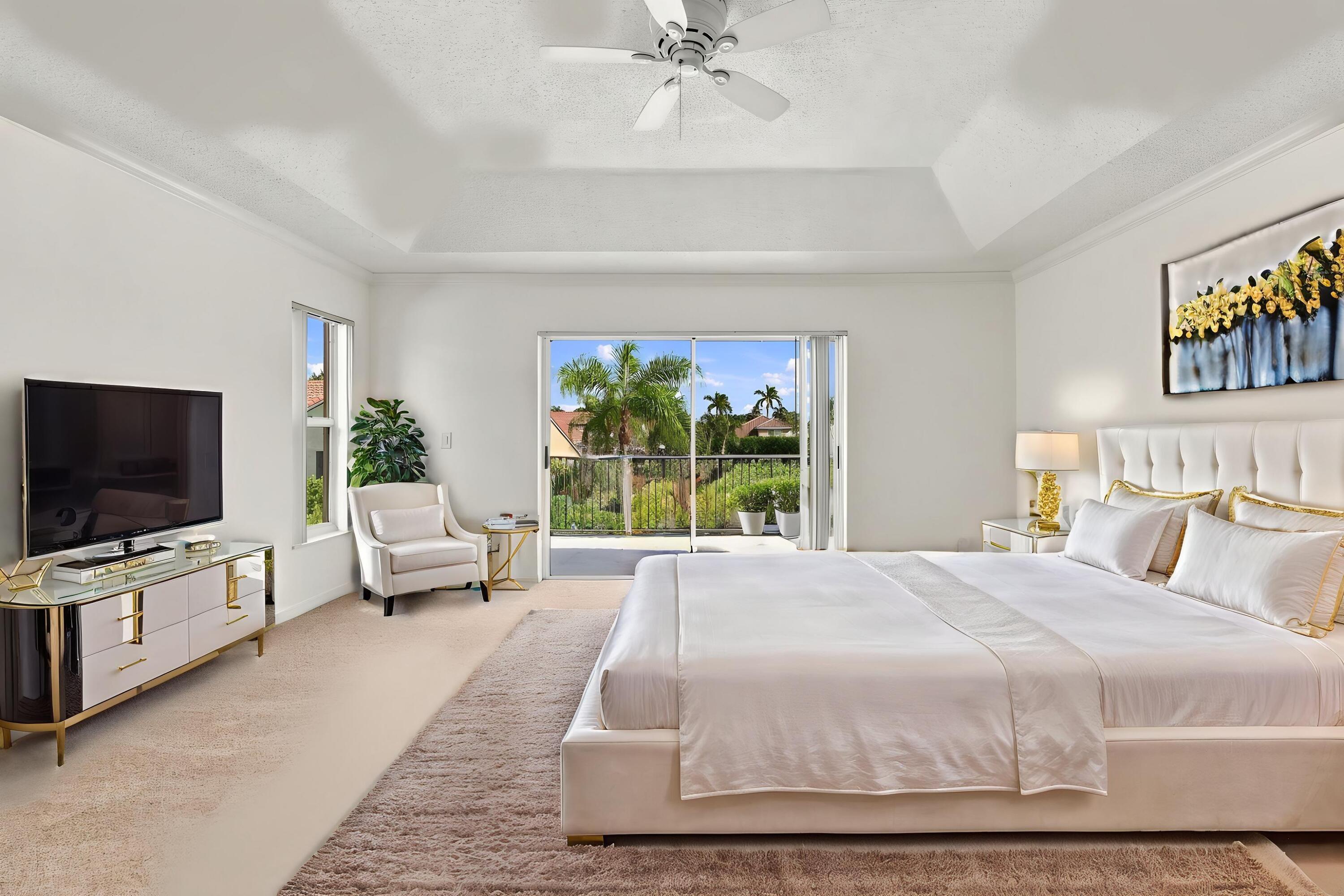 Wake up to beautiful waterfront views! Sliding glass doors open directly onto a private second-story balcony overlooking the tranquil lake and tropical surroundings.