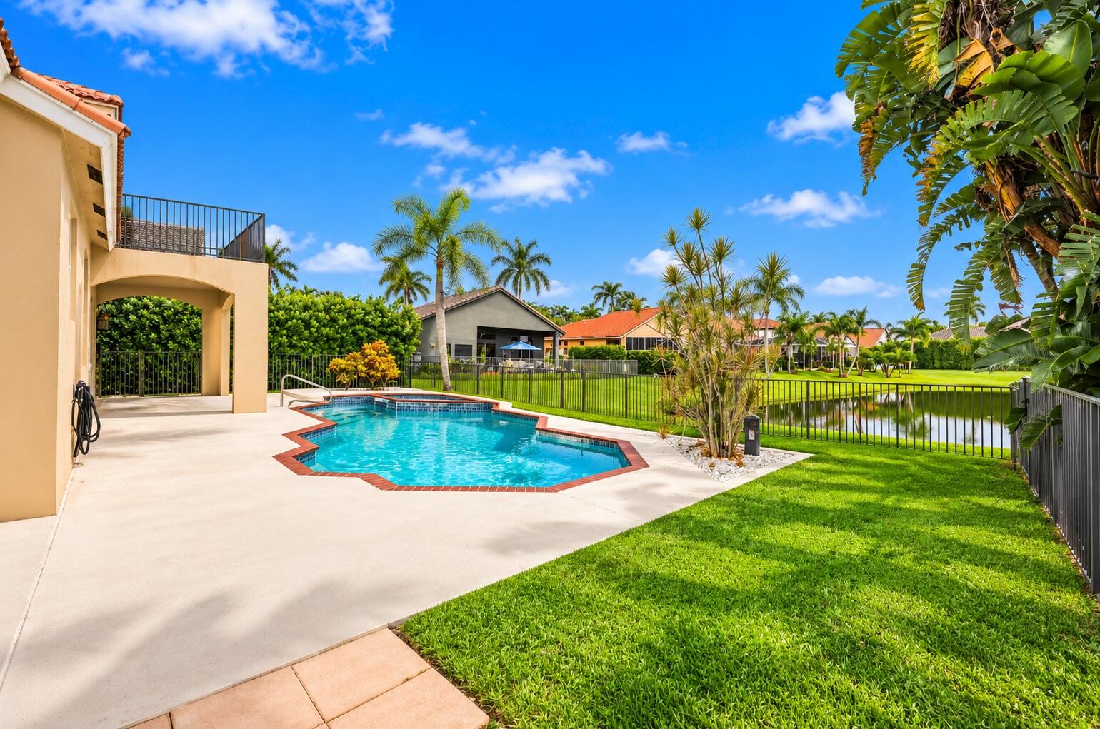 Your own private waterfront paradise! Enjoy the sparkling pool and spa surrounded by lush tropical landscaping and breathtaking lake views.