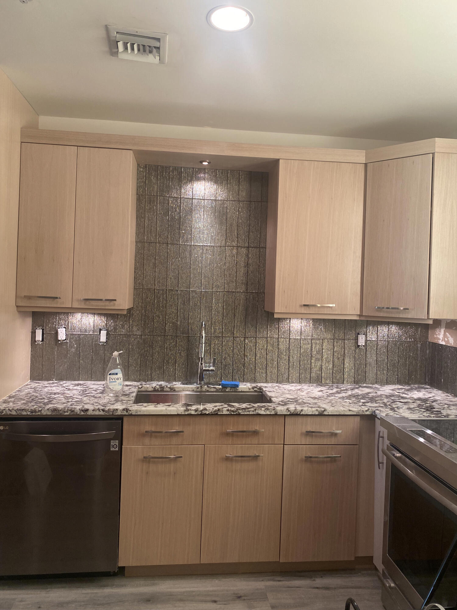 Kitchen with plenty of lighting for work areas. Kitchen with plenty of lighting for work areas.