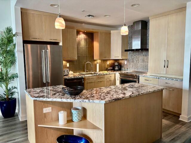 Kitchen with new appliances and Jenair charcoal filtered hood