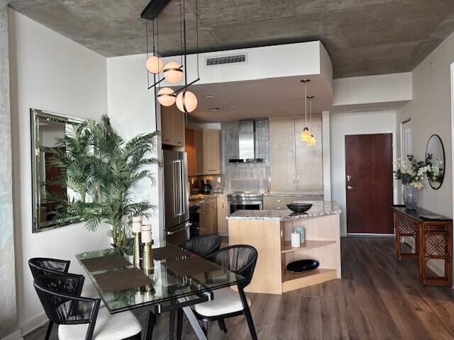 From Living Room to Dining with chandelier and to Kitchen with island providing storage and prep area. From Living Room to Dining with chandelier and to Kitchen with island providing storage and prep area.