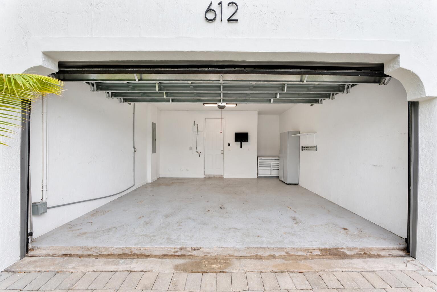 Clean Empty Garage with House Number 612