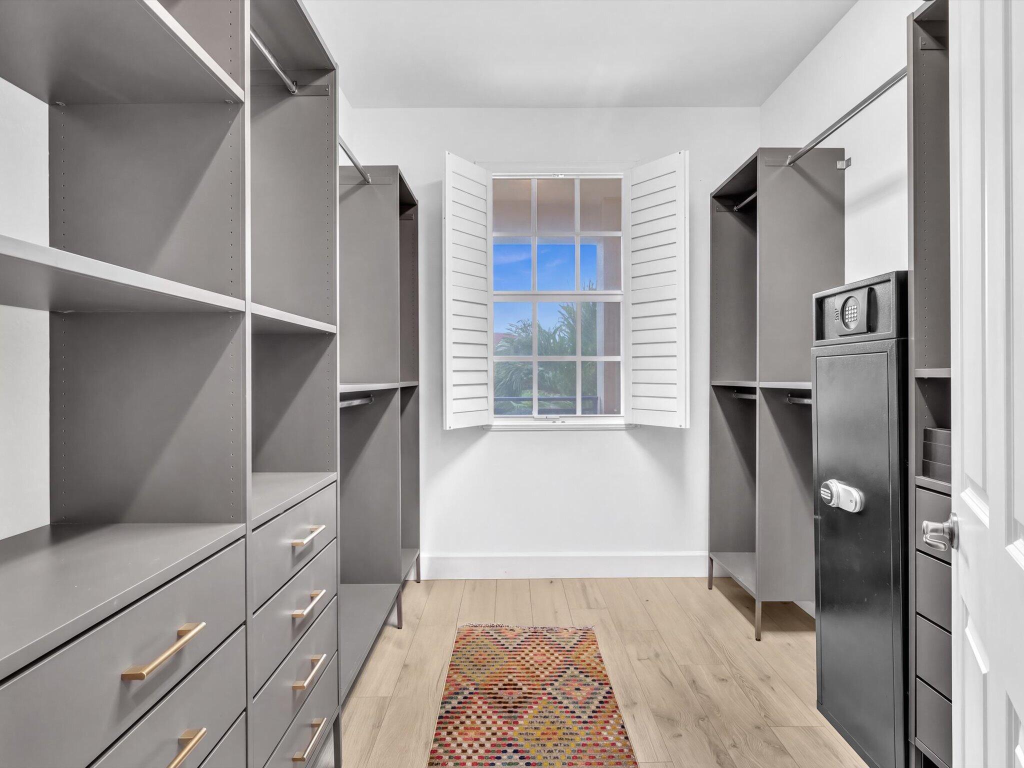 Primary bedroom walk-in closet.