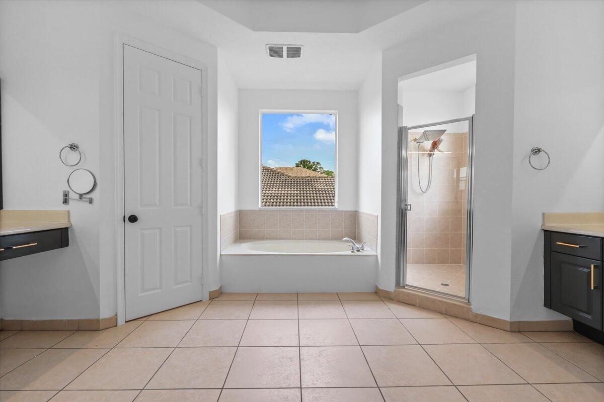 EN-SUITE BATHROOM WITH ROYAL TUB IN MAIN MASTER SUITE ON SECOND FLOOR