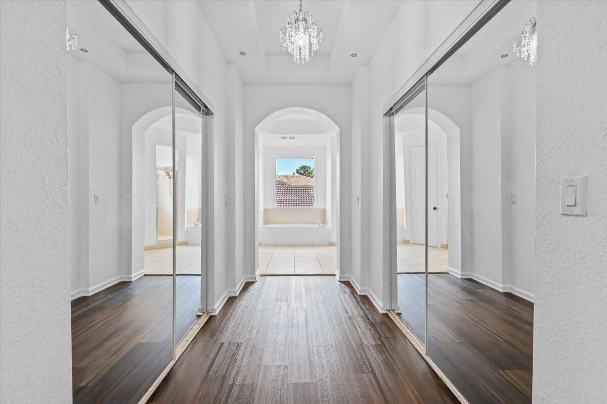 EN-SUITE WALK-IN CLOSET HALLWAY IN MAIN MASTER SUITE ON SECOND FLOOR
