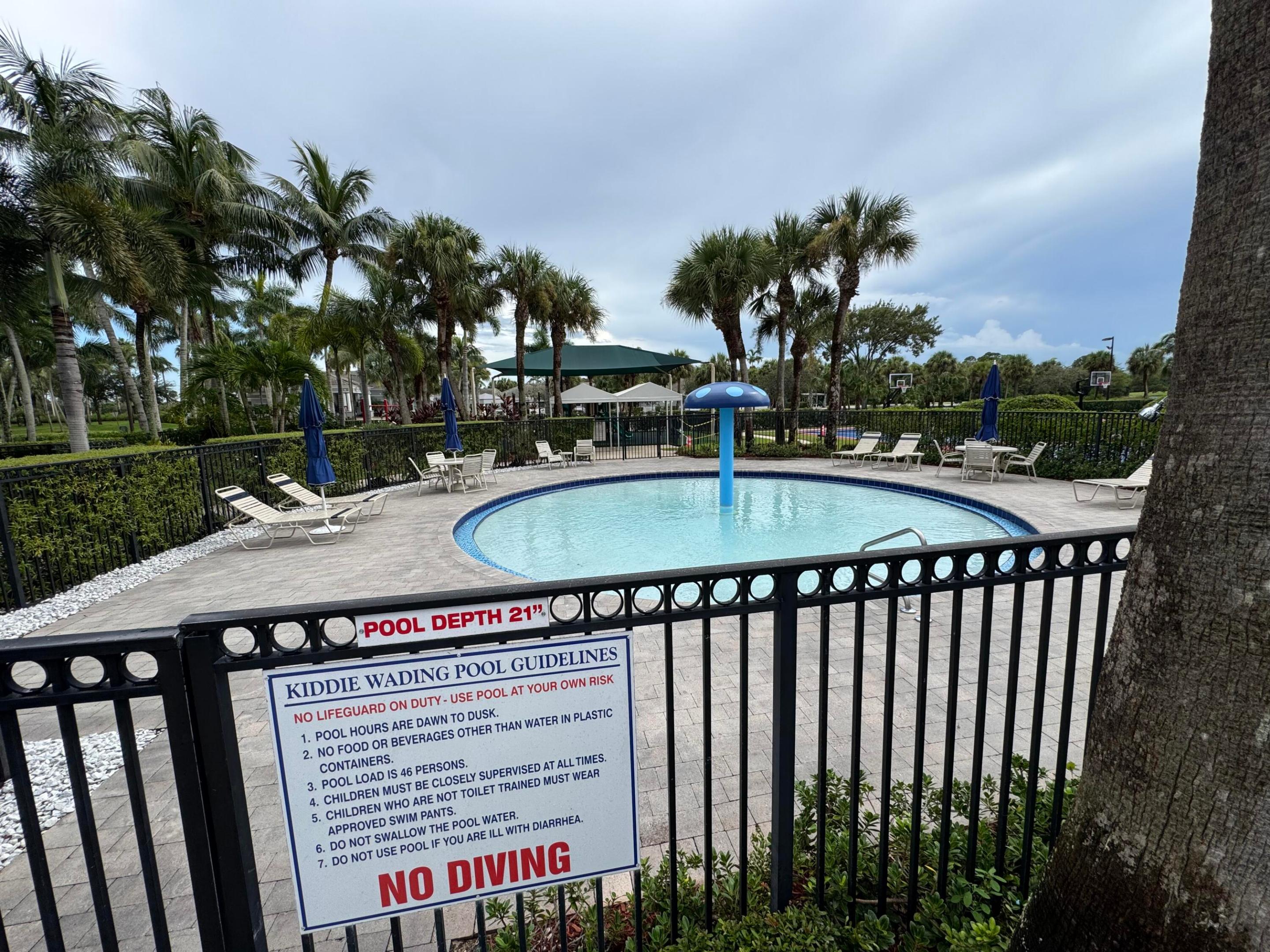 ENCLOSED CHILDREN'S SWIMMING POOL INSIDE THE CLUBHOUSE FACILITY