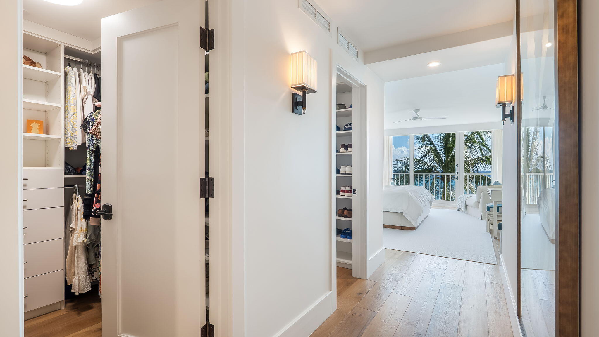 Hallway with 2 walk-in closets