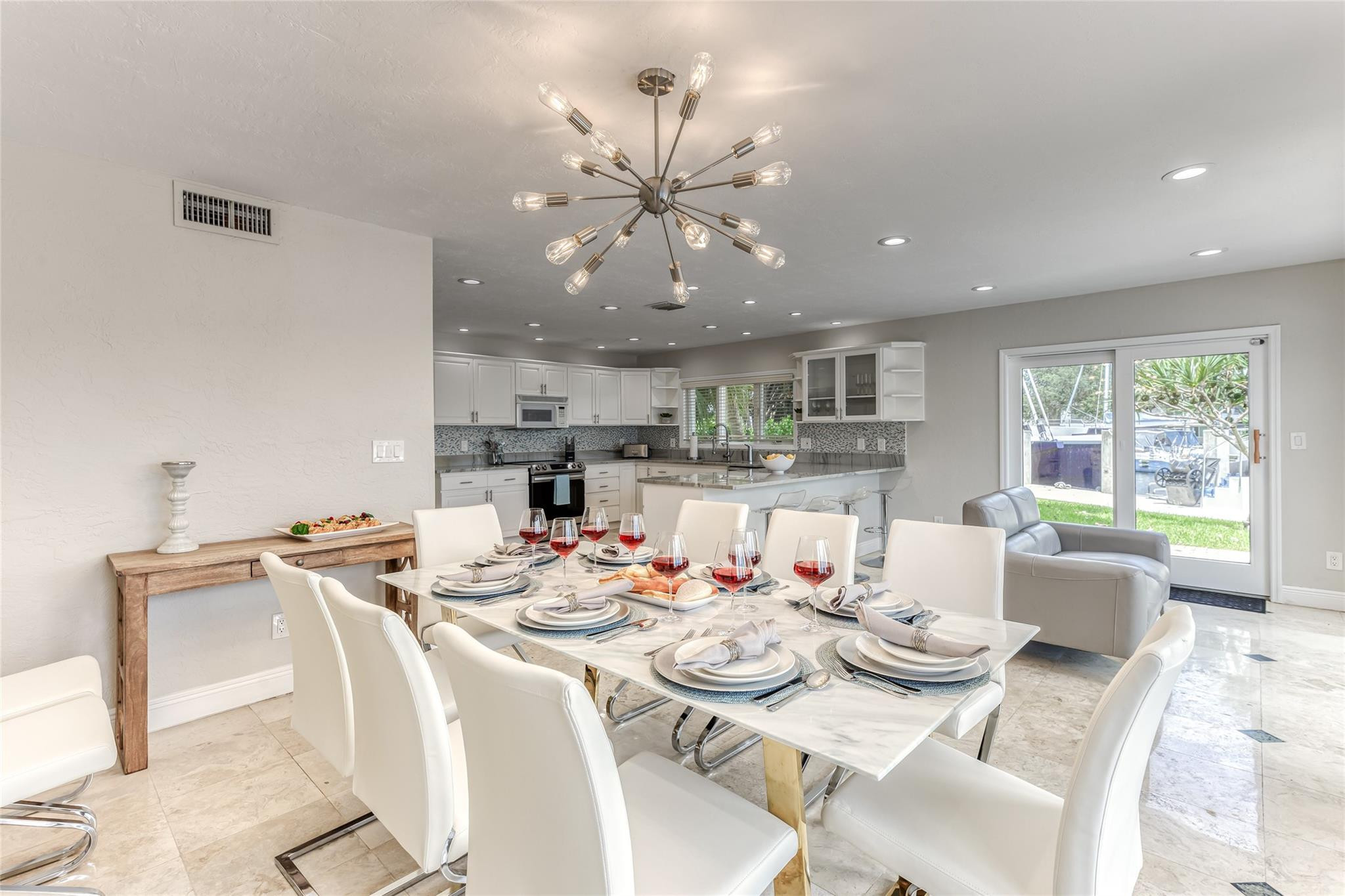 Dining Room Seating for 8 of Kitchen overlooking pool & waterway.