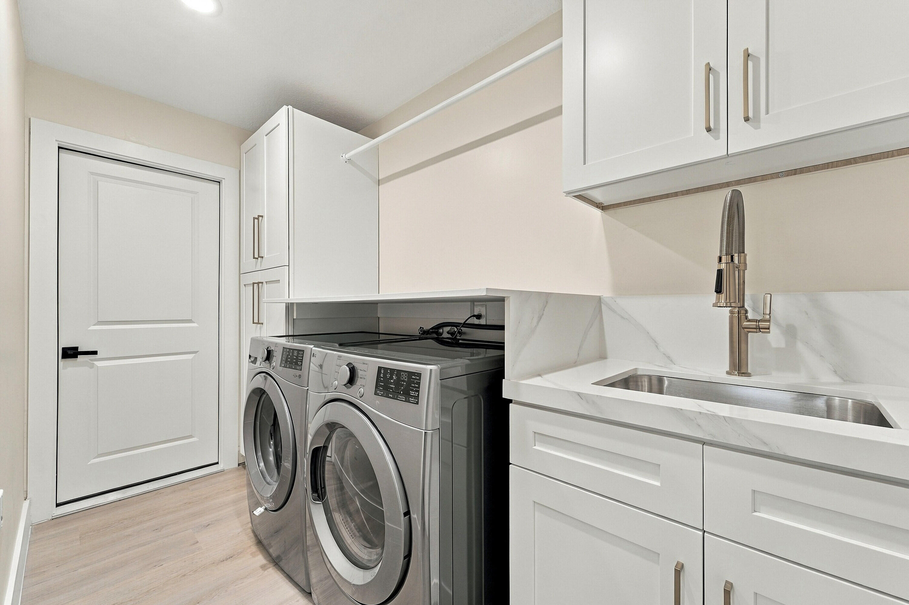 Brand new GE washer and dryer and custom cabinets to make this laundry room ideal