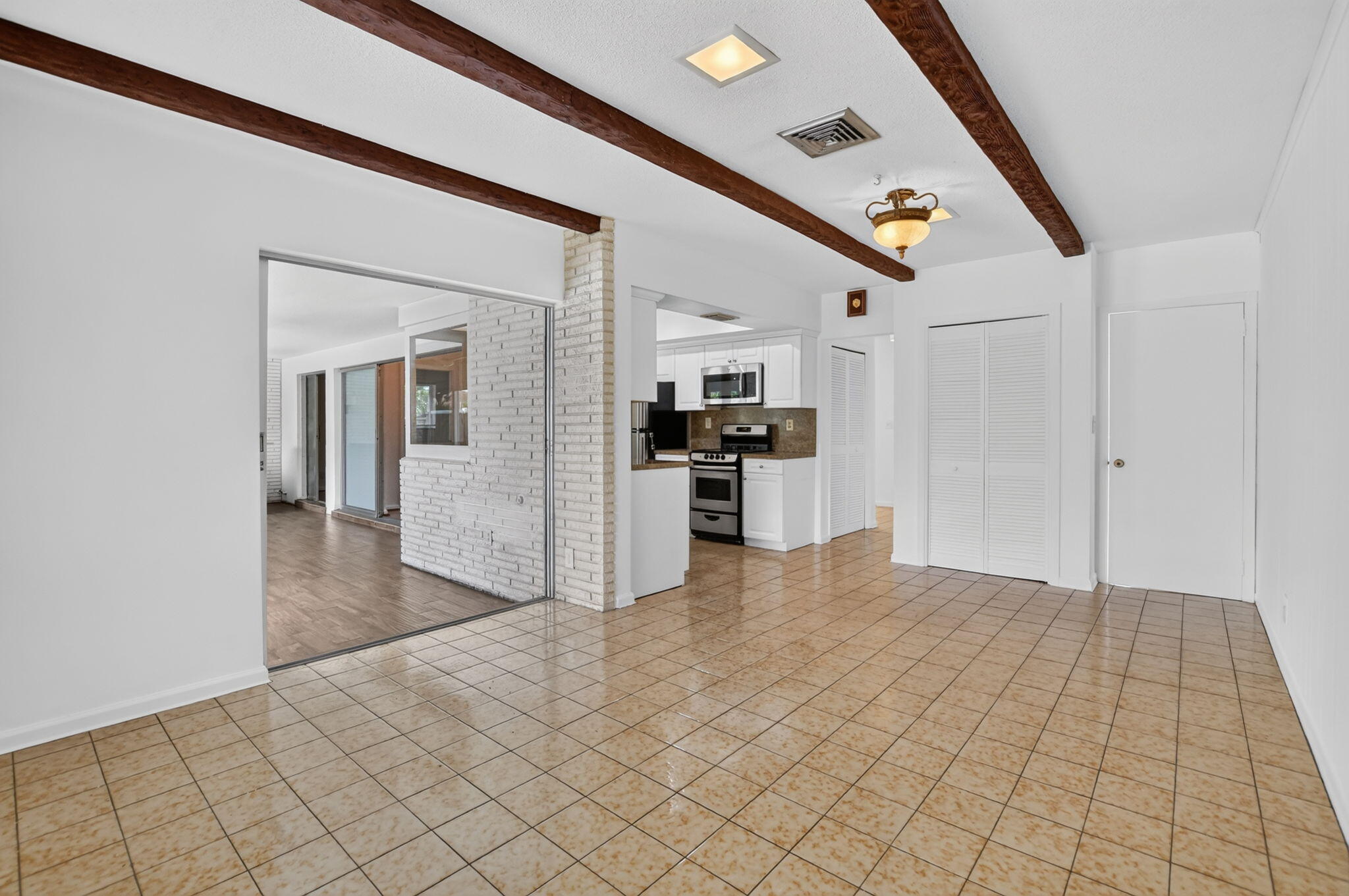 Family Room with Wood Beam Ceilings