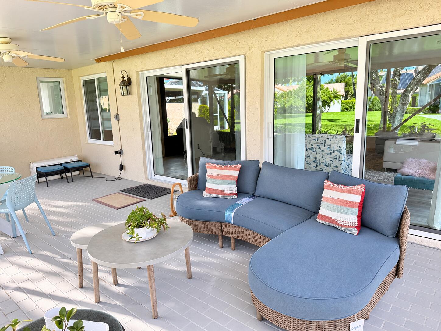 Sunlit Coastal Patio with Wicker Seating