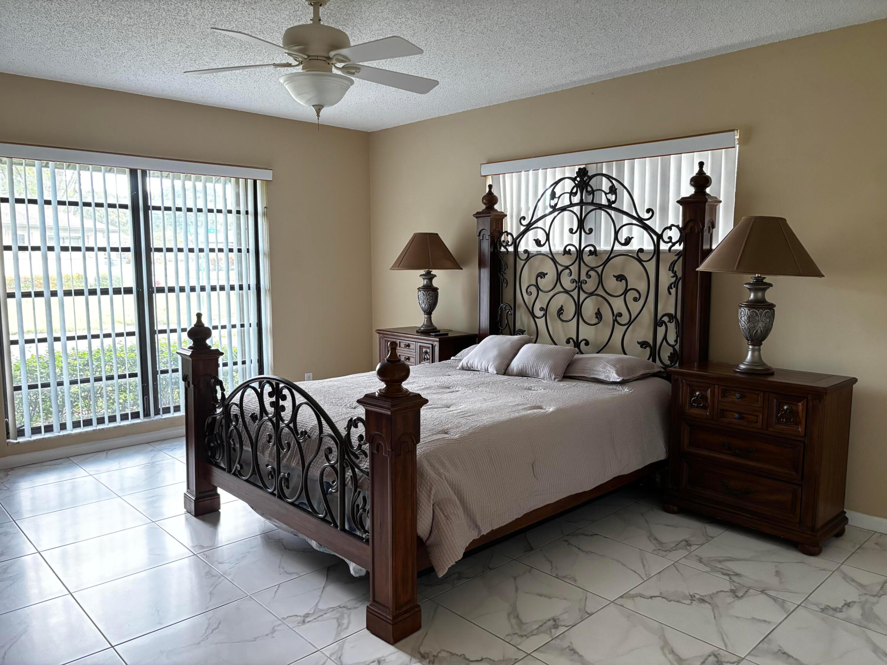 Primary Bedroom, with large windows an abundant natural light