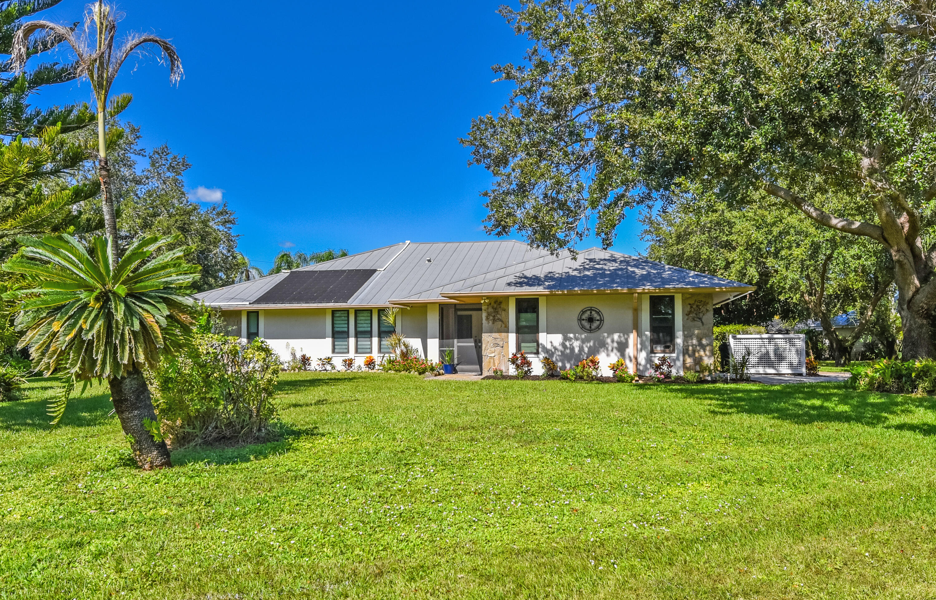 Enjoy the beauty of Sandpiper Bay! This inviting home sits on a beautifully landscaped .49-acre lot with mature trees, a lush green lawn, and plenty of room to enjoy the outdoors. No HOA!