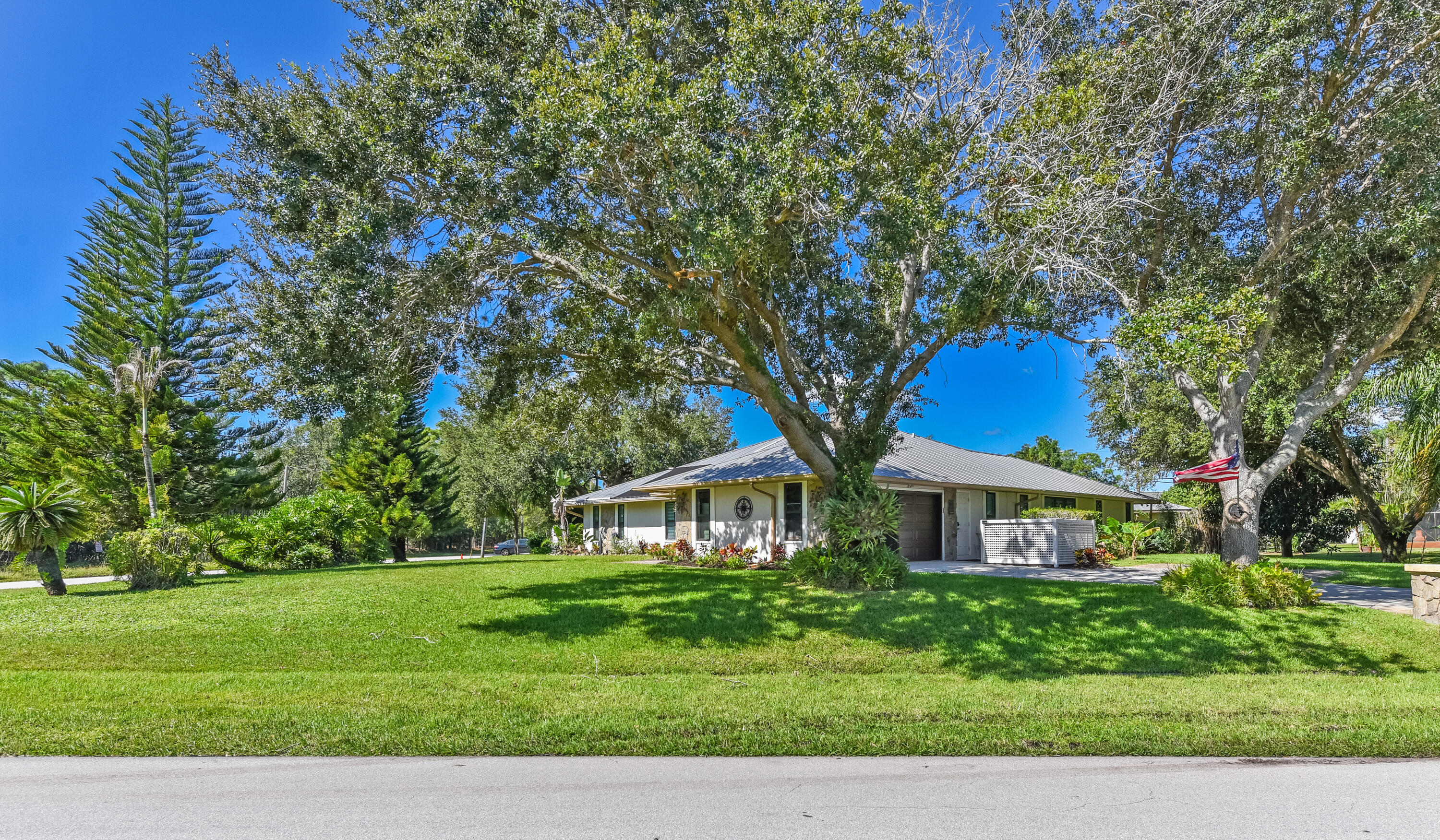 What a setting! Towering mature trees provide wonderful shade and character to this impressive .49-acre corner lot in Sandpiper Bay. No HOA!