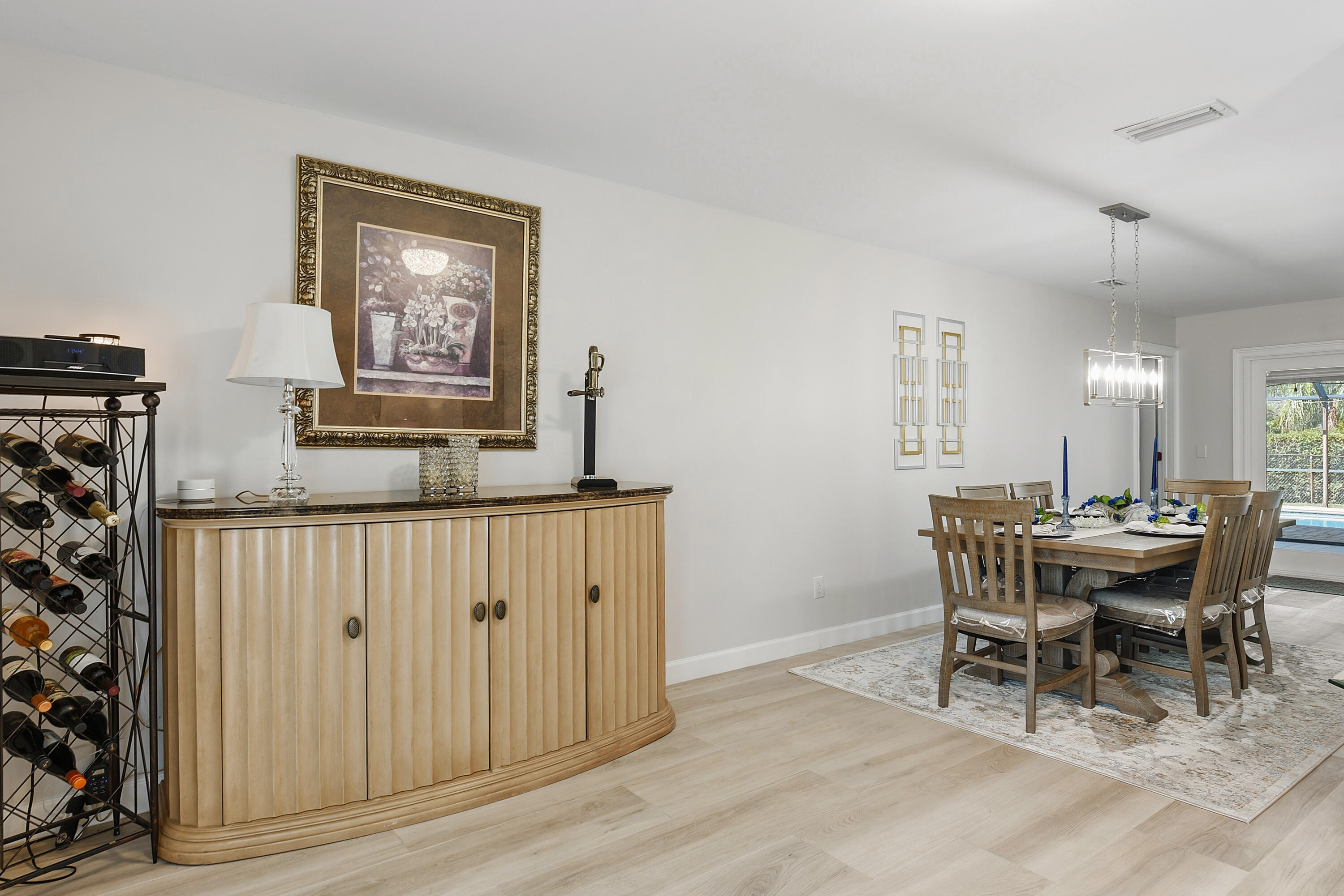 Open layout with easy access to the pool and outdoor living area.