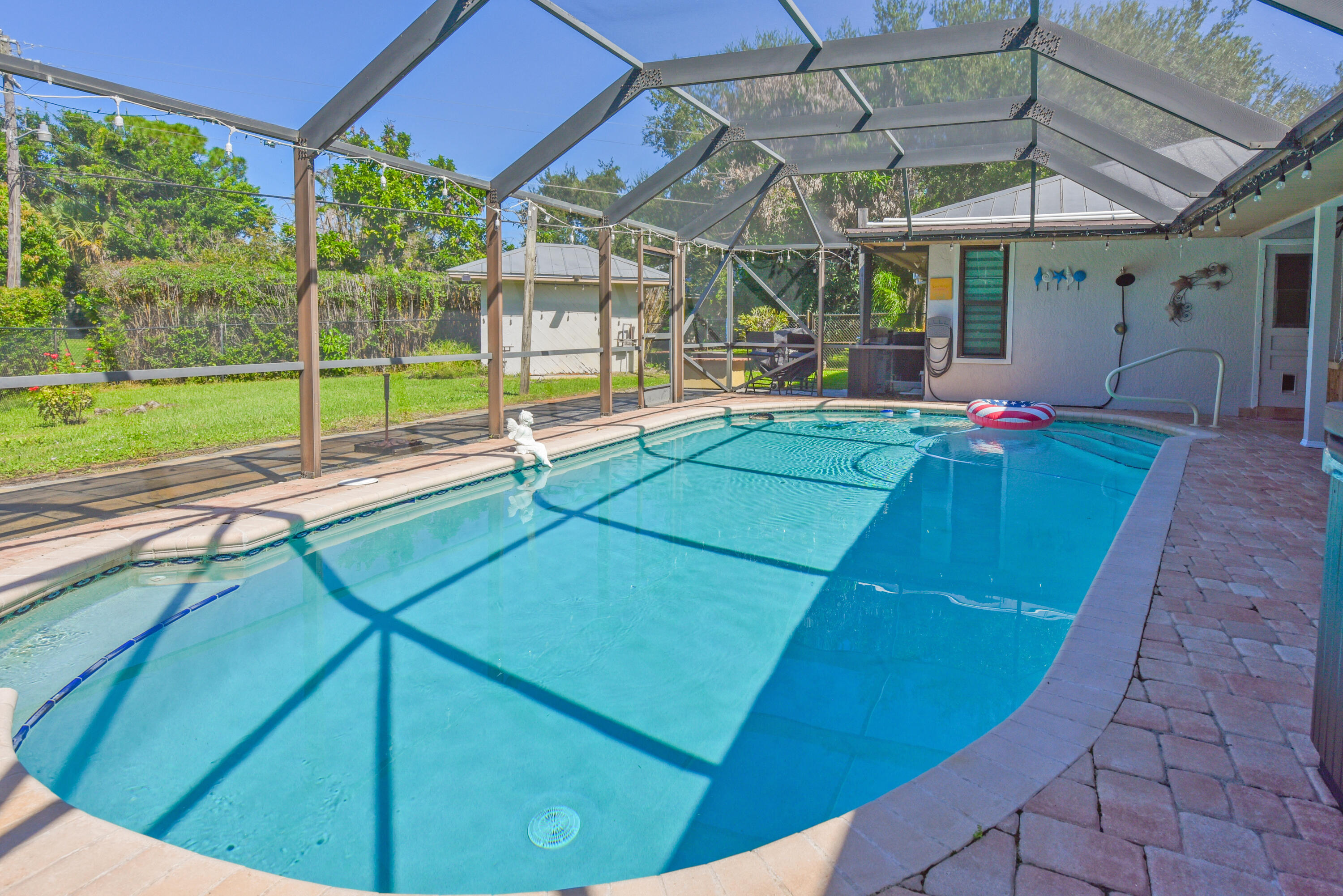Take a refreshing dip in your heated saltwater pool! Enjoy a screened enclosure, beautiful paver decking, and your own private backyard retreat.