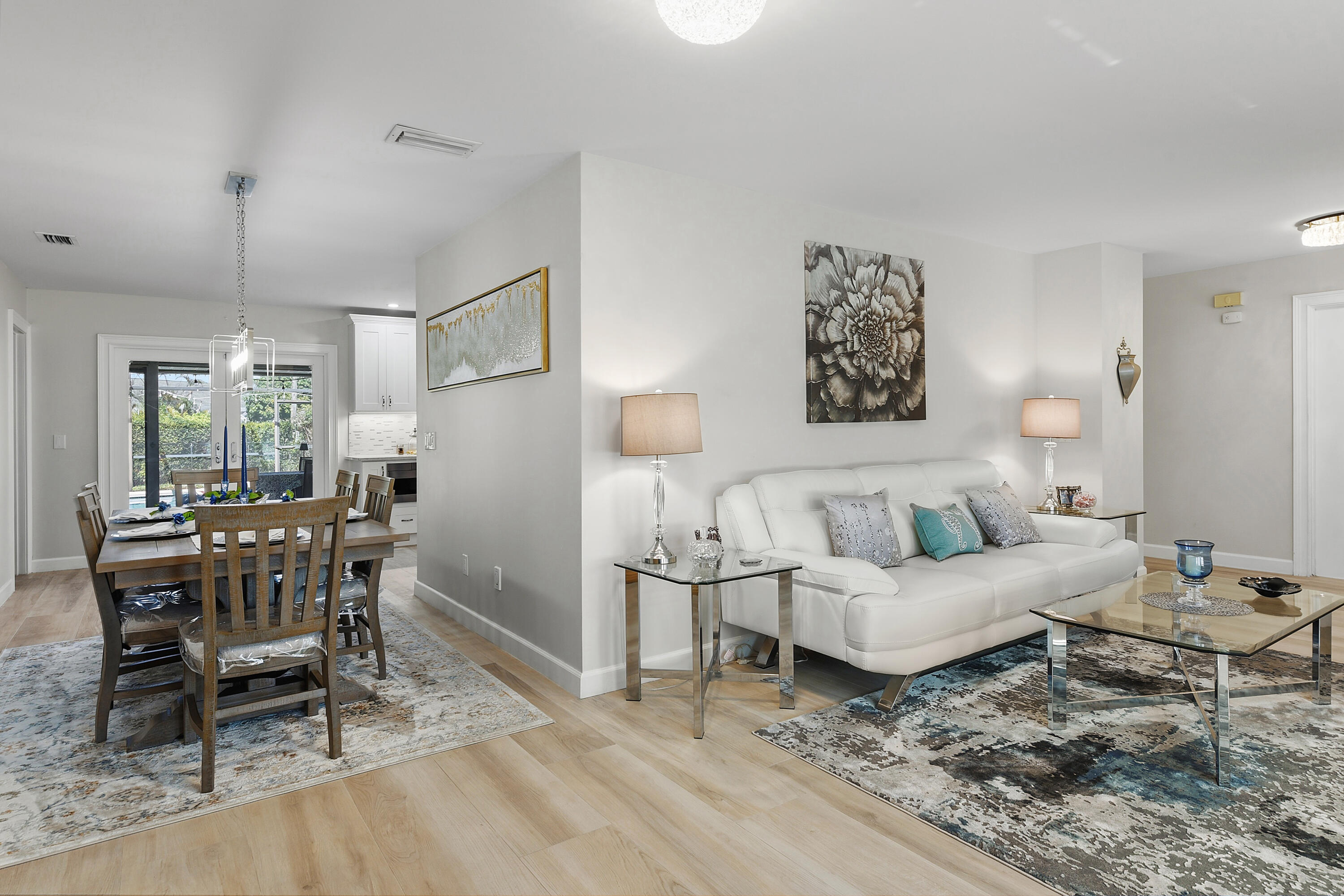 Airy layout create the perfect setting for everyday living and entertaining, with easy access to the screened pool area.