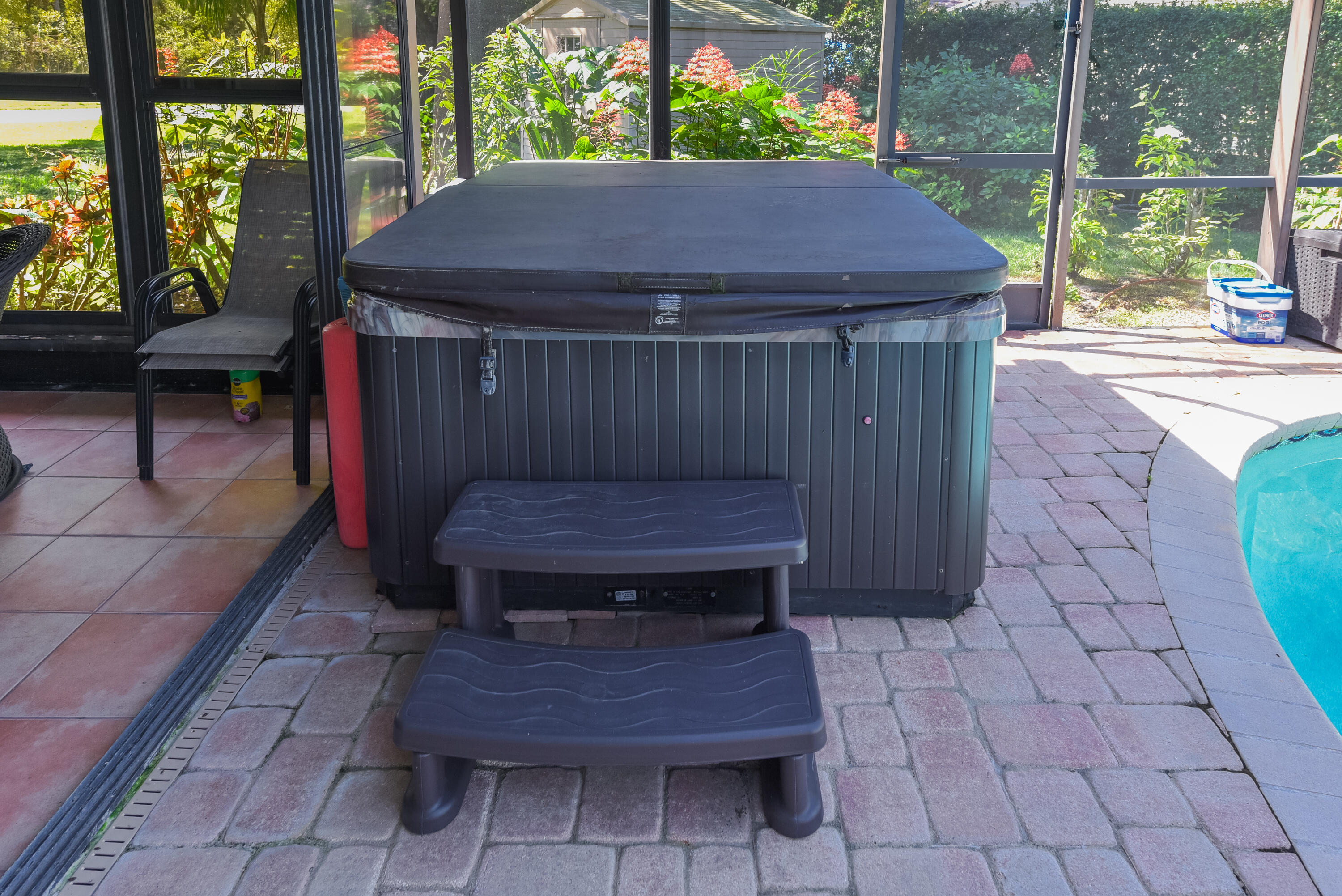 Enjoy your own private spa, conveniently located beside the pool within the screened enclosure. A wonderful spot to unwind and enjoy Florida living!
