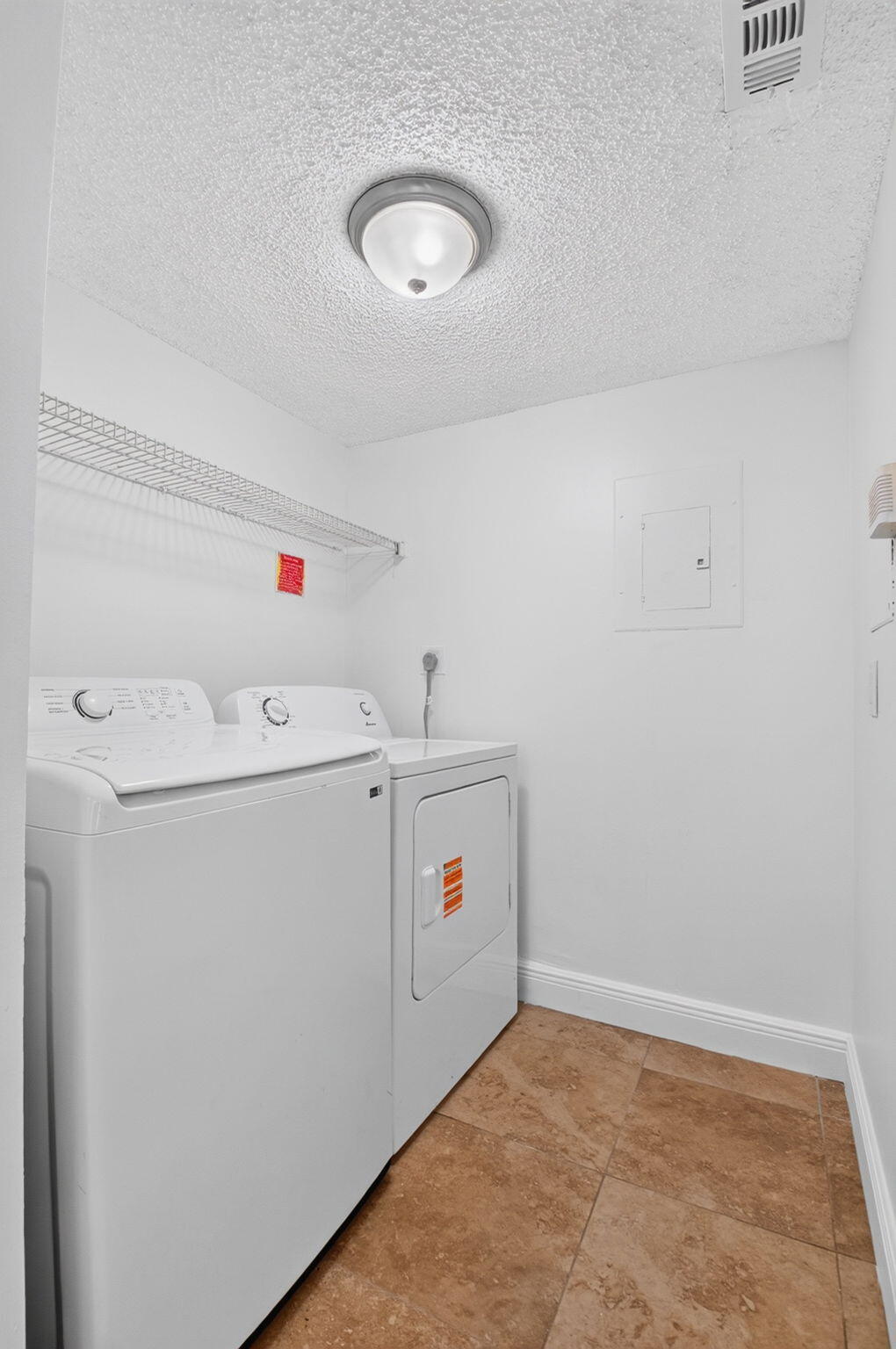 Laundry room with full-size washer/dryer and pantry