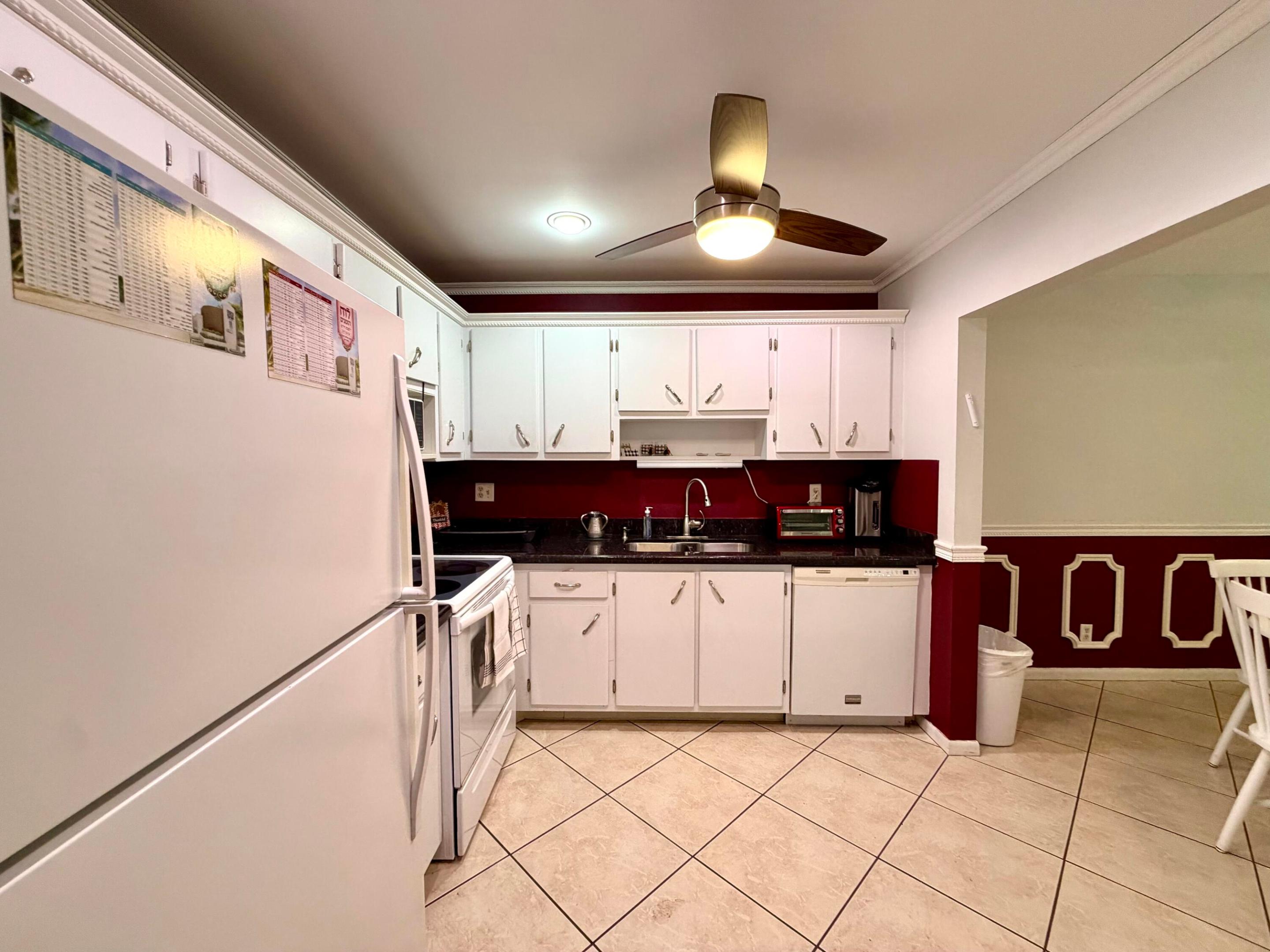 kitchen features refrigerator, microwave, dishwasher, double sink