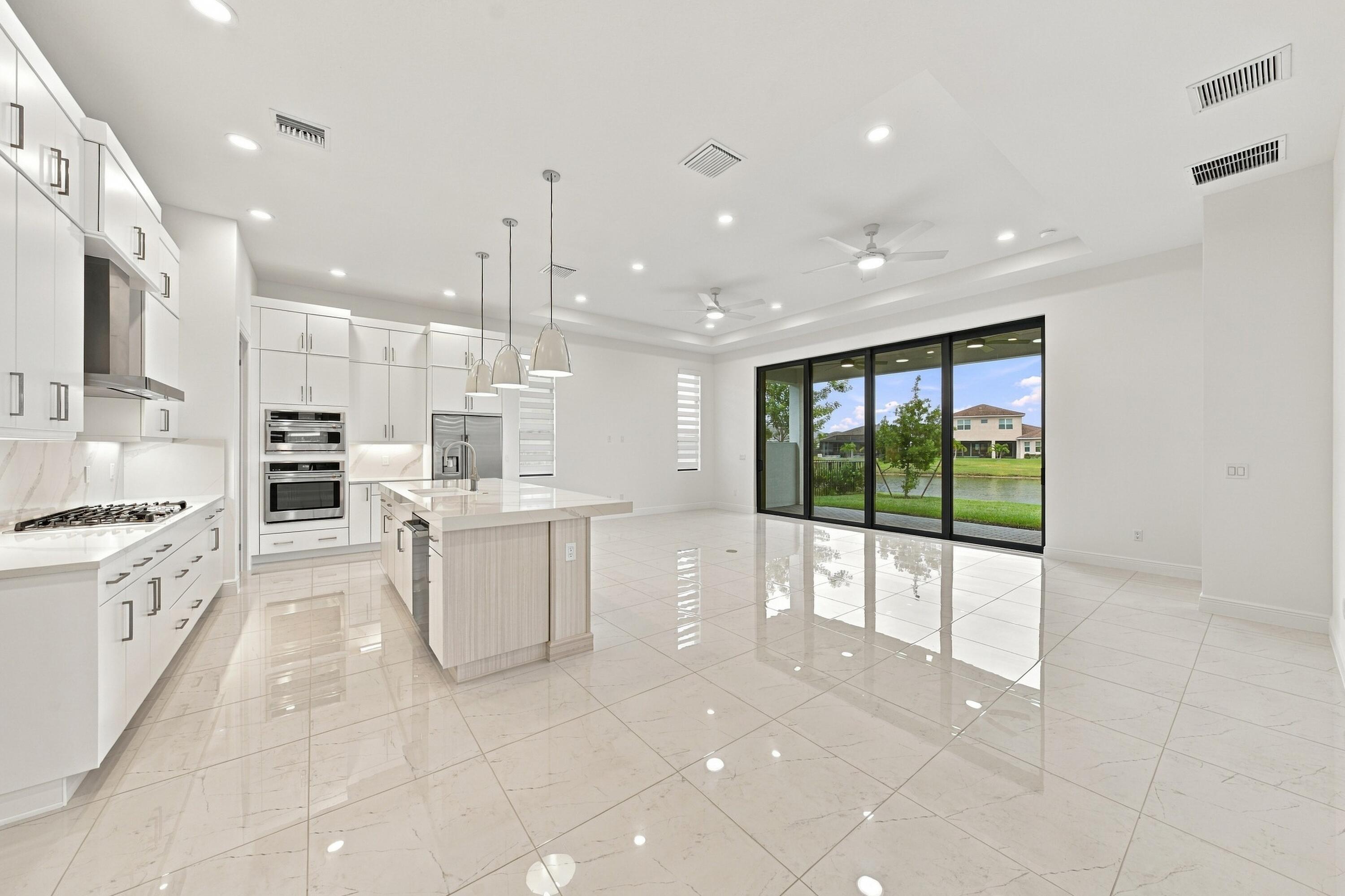 Great room, kitchen island and dining room